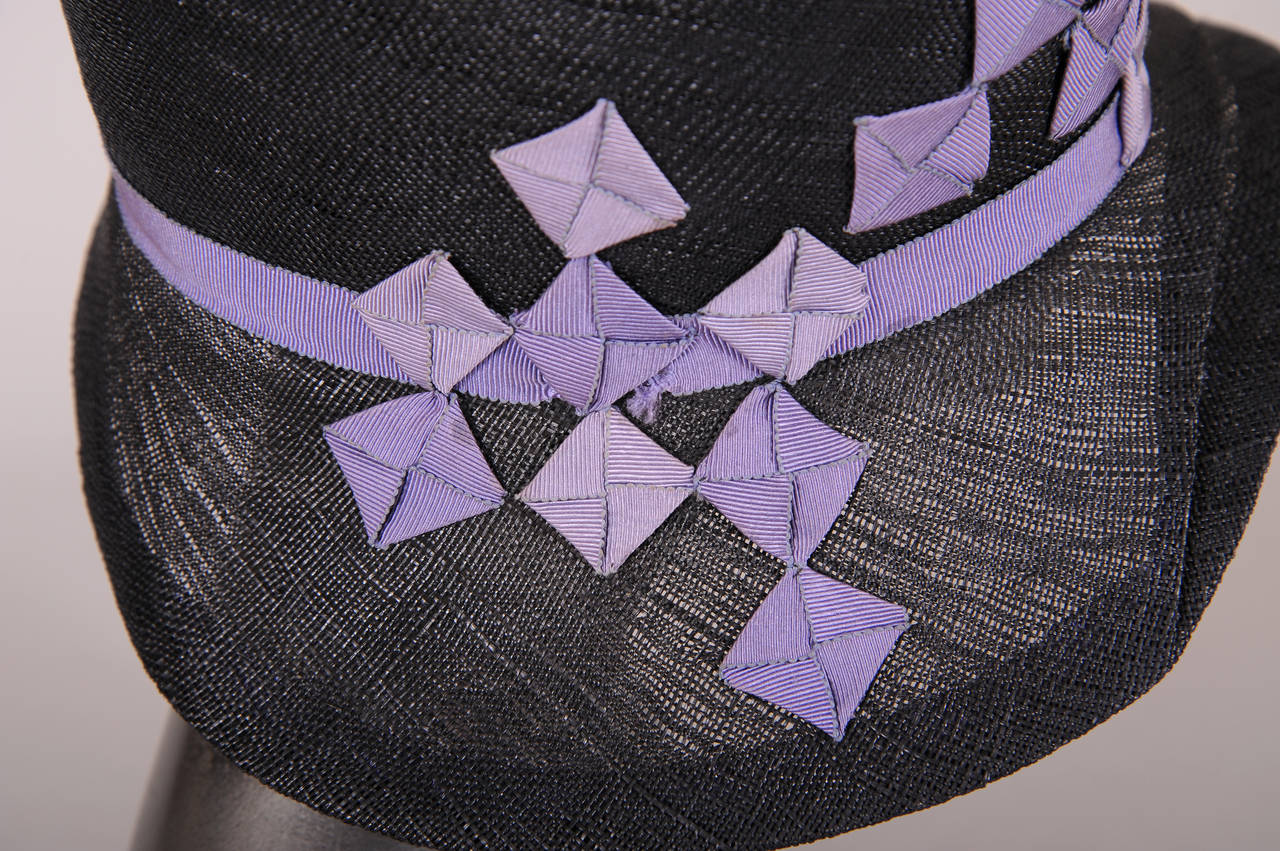 black top hat with purple ribbon