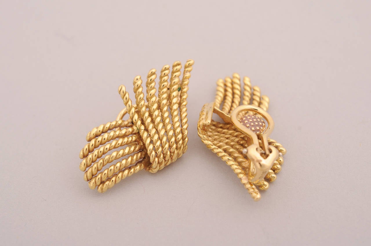 Classic rope turned  earrings in 18 karat gold are designed by Jean Schlumberger for Tiffany & Co.  They are clip back earrings, but could easily be converted for pierced ears. The earrings come in their original Tiffany blue suede pouch and box