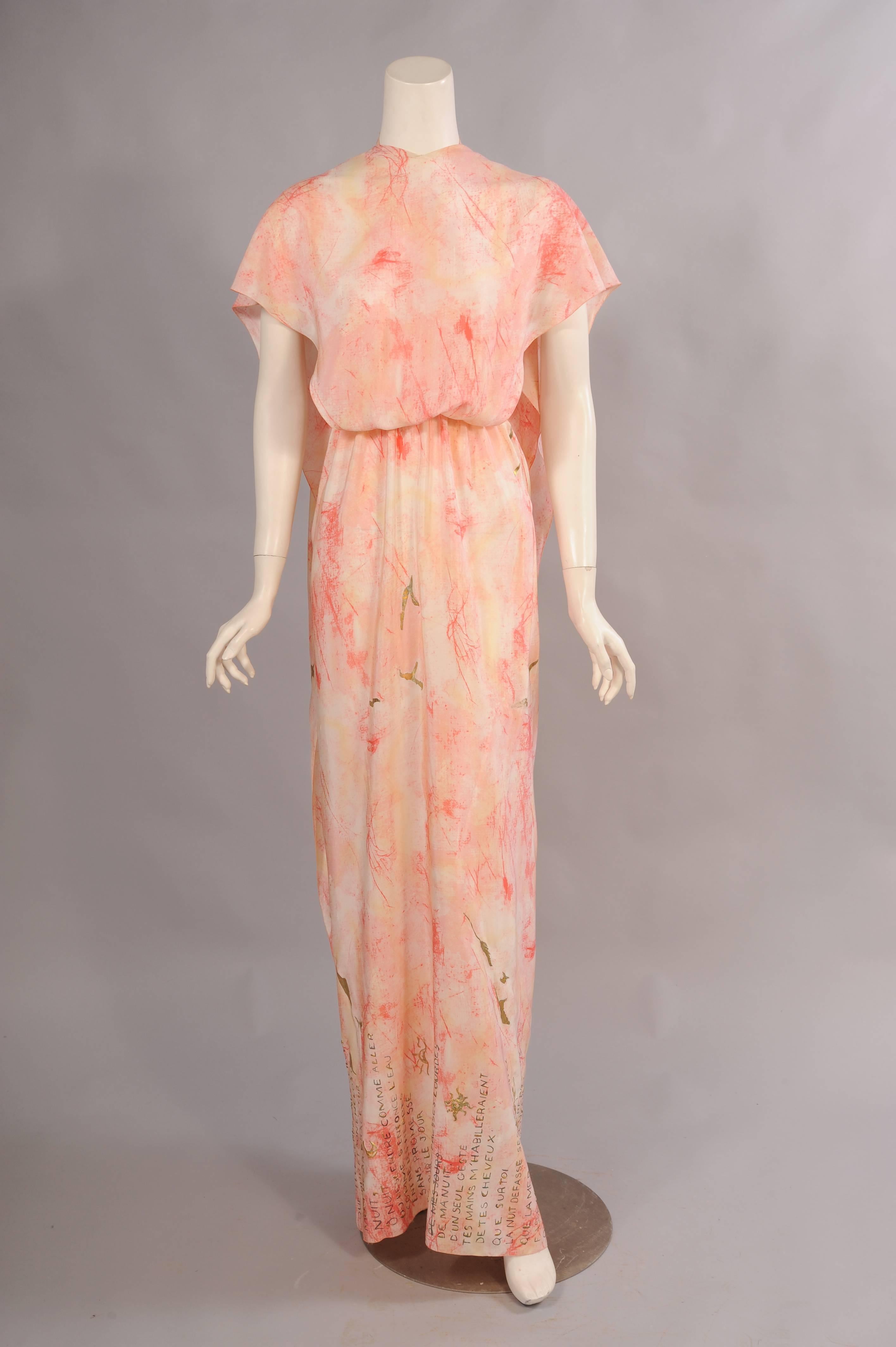 This 1970's hand painted silk dress from Chloe is just amazing. There is a halter top that ties at the back of the neck, a large panel drapes over this and it can be worn loose and draping at the back or tied loosely.  This piece is hand painted and