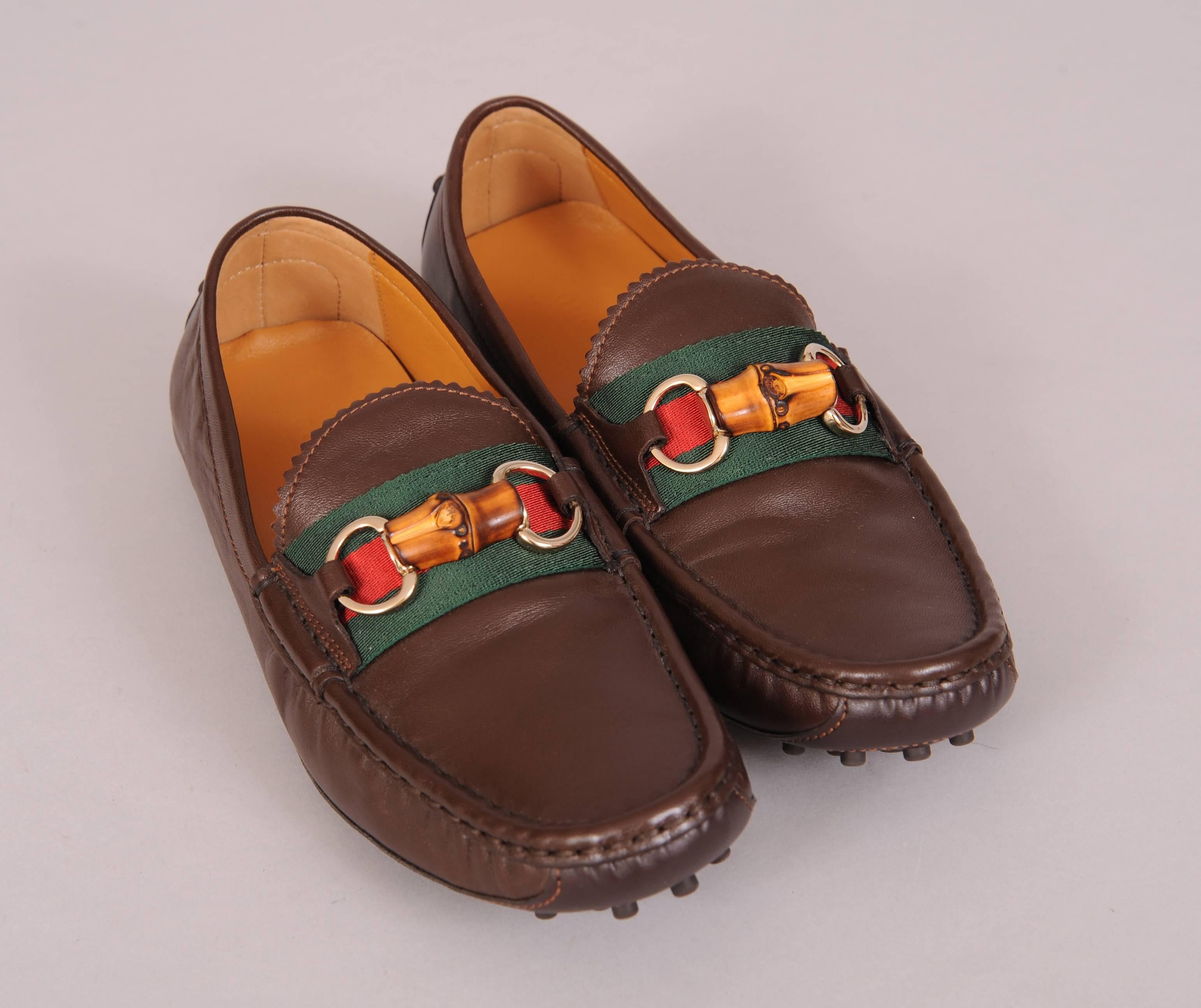 Dark chocolate brown buttery soft leather is accented with the classic Gucci red and green stripes and a bamboo snaffle bit. The loafers have driving soles and a full leather interior. Never worn and marked a size 38 1/2, they are in excellent