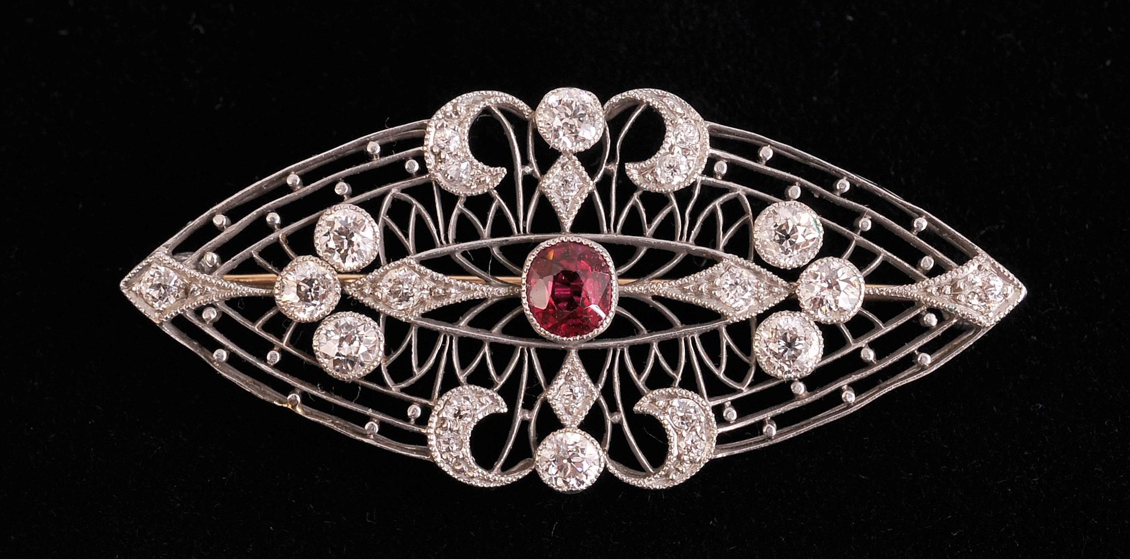 An intense pigeon blood red Burma ruby is the central stone in this striking platinum filigree brooch. It is surrounded by old mine diamonds. This stunning piece is in excellent condition
Stones
Ruby   Intense pigeon blood red Burma ruby weight .65