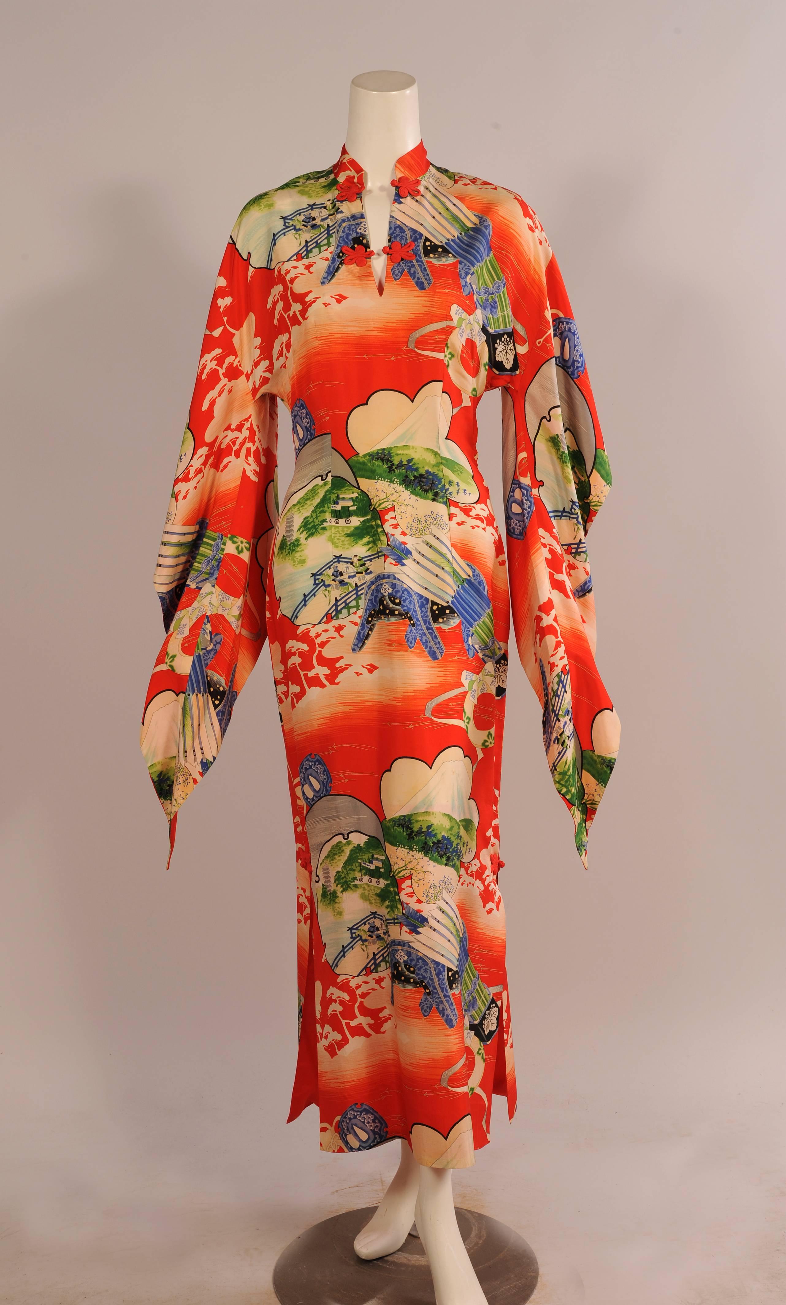 Bright and cheerful this red silk print dress has two red frog closures at the Mandarin collar neckline. There are two more above the openings on either side of the dress. The sleeves are an amazing version of a Japanese kimono sleeve, narrow and