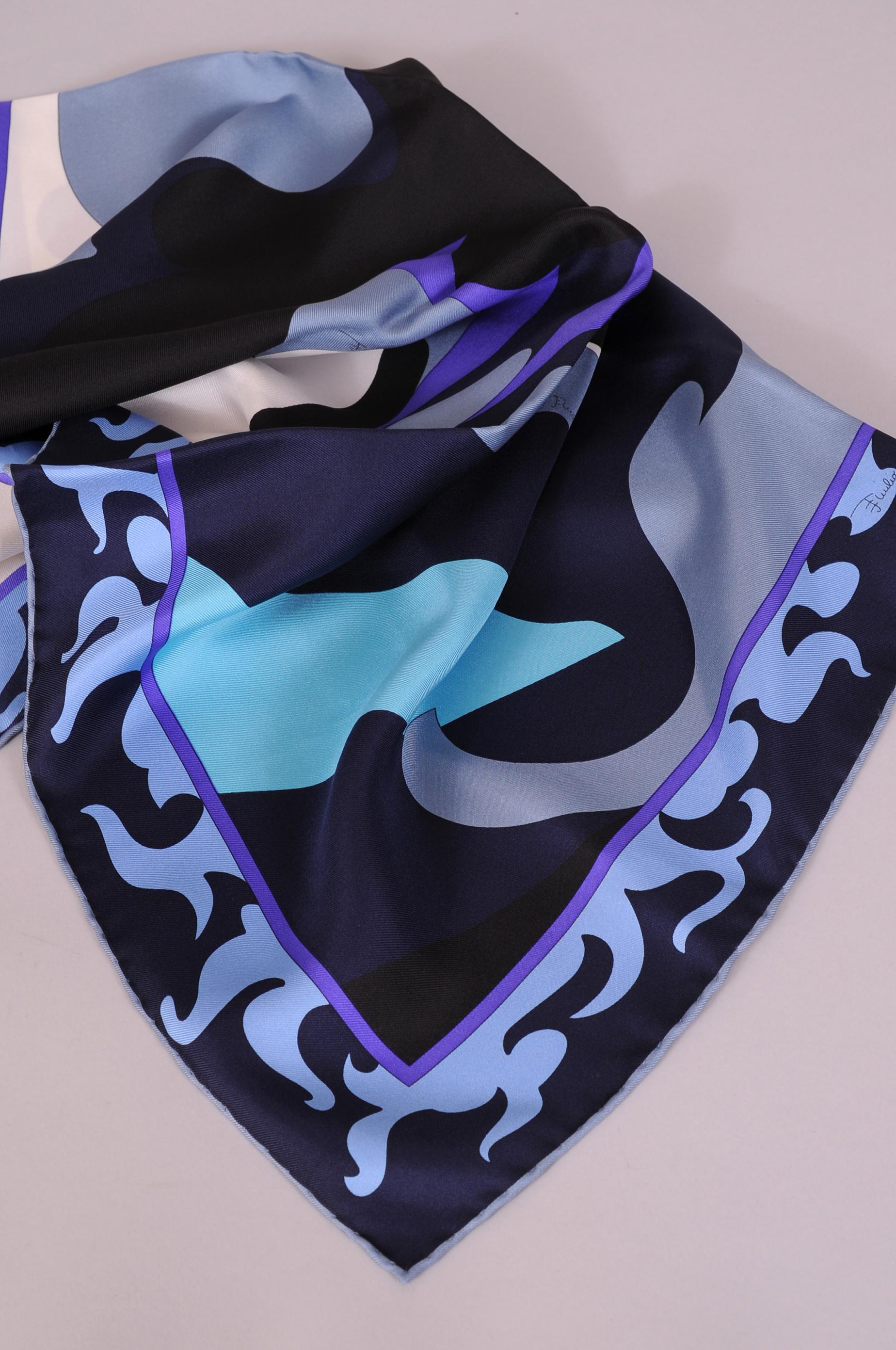 Black and blue with purple, turquoise, grey and white are used for this colorful, small size scarf from Pucci. It is in excellent condition.
Measurements;
22