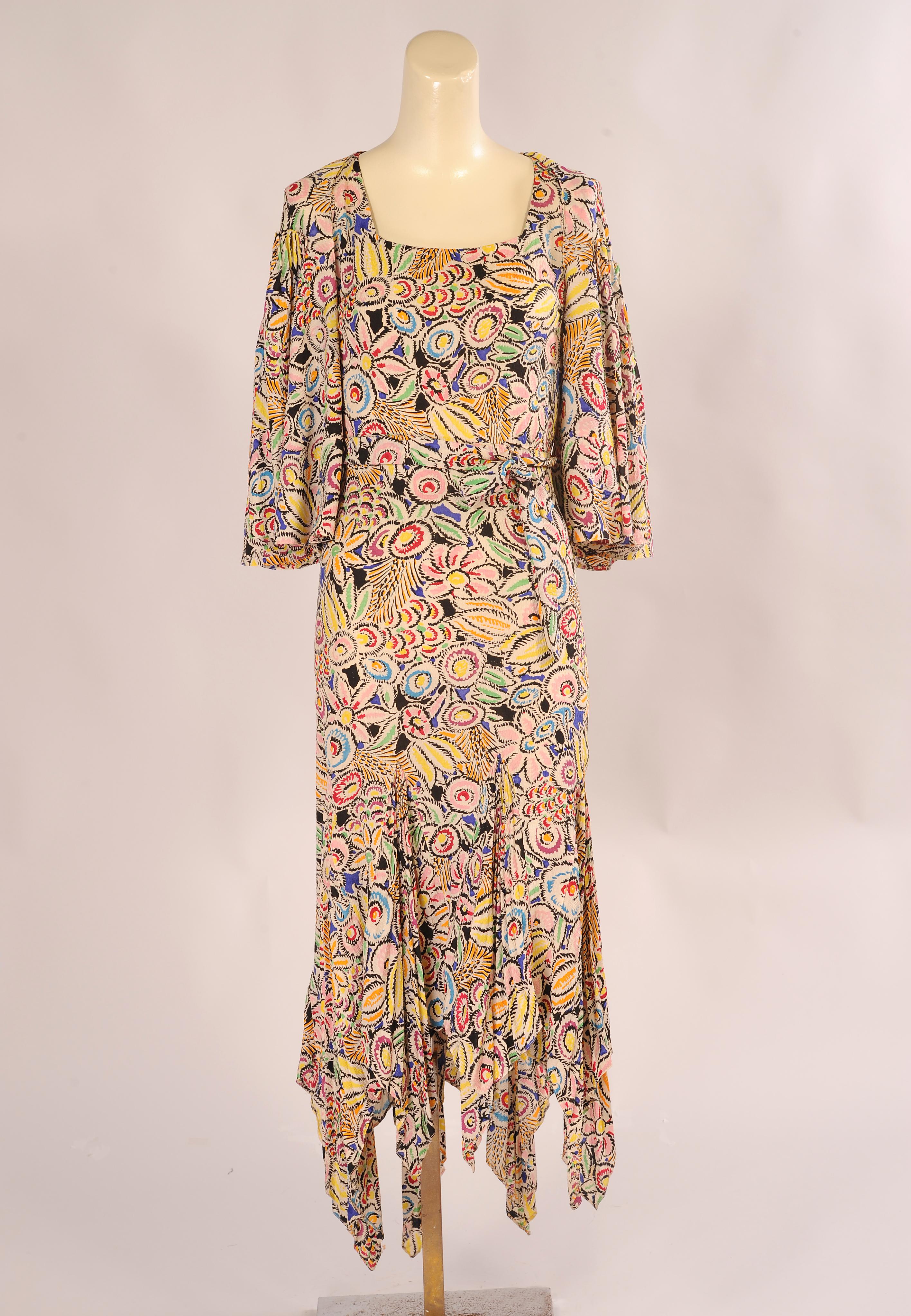 This dress reminds me of the south of France, it is very much in the style of Zelda and F. Scott Fitzgerald. It embodies the vibrant colors of the plants and flowers blossoming on the French Riviera. There is no label in the dress but it was