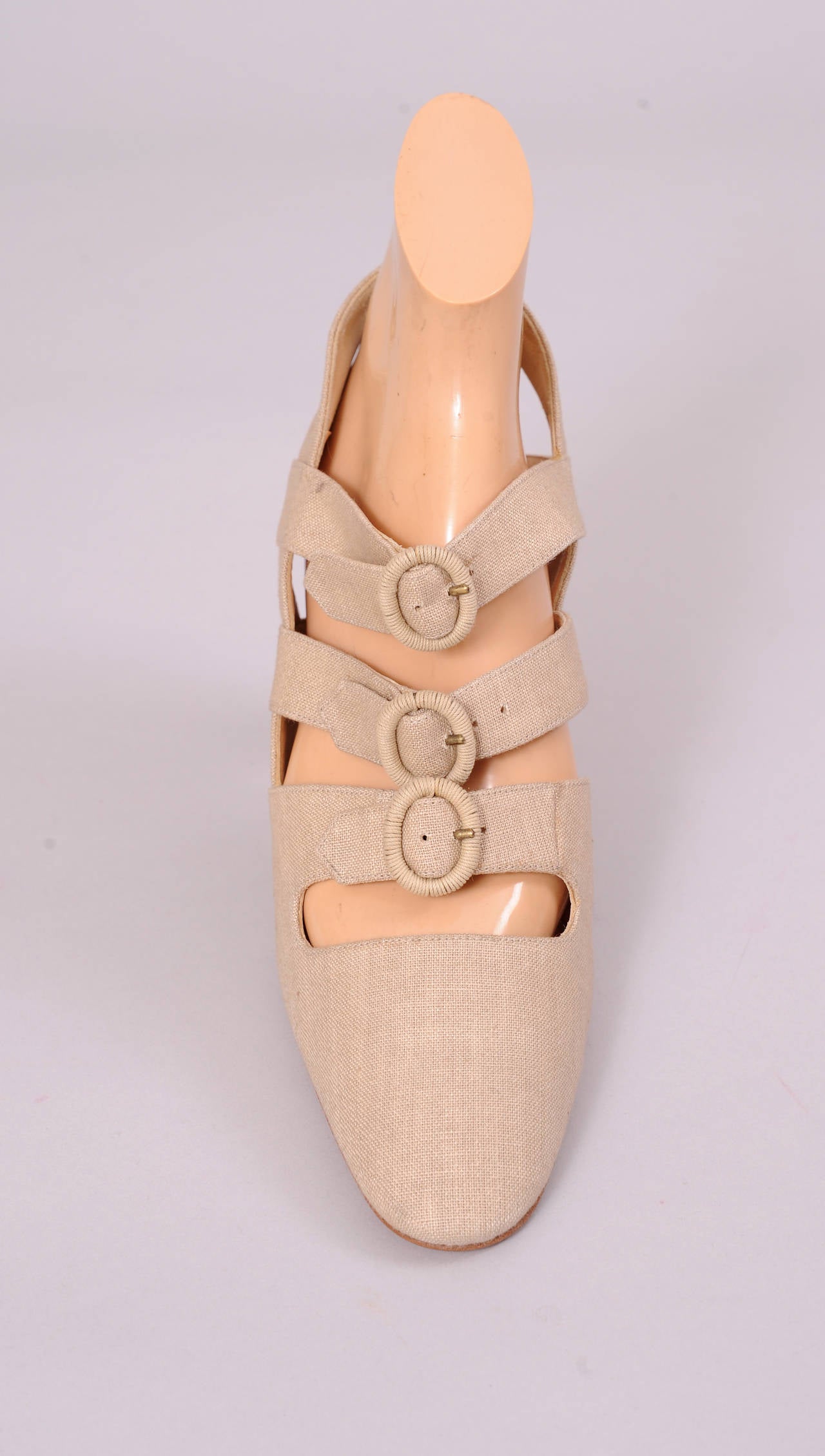 A gorgeous summer shoe, this linen heel form Philippe Model has three buckled straps across the top of your foot and a suede stacked heel. Never worn, they are in excellent condition, and marked a size 40 1/2.