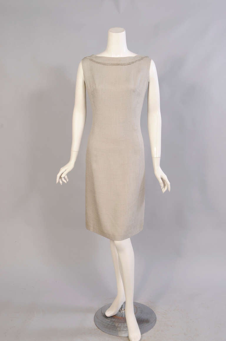 Simple and elegant, as the French do so well, this little linen dress and jacket are trimmed with self fringe. The sleeveless sheath dress is fully lined and has a center back zipper. The jacket has notched lapels, 3/4 sleeves, fringe trim, and a