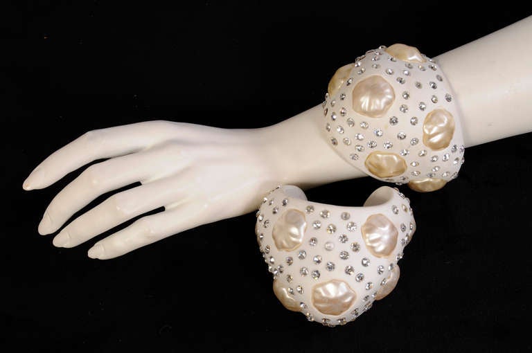 My client, an International Socialite, is a regular attendee at the Haute Couture fashion shows in Paris and Milan.  Studded with "diamonds" and "pearls" the cuffs are made from white resin. Because they were worn on the runway