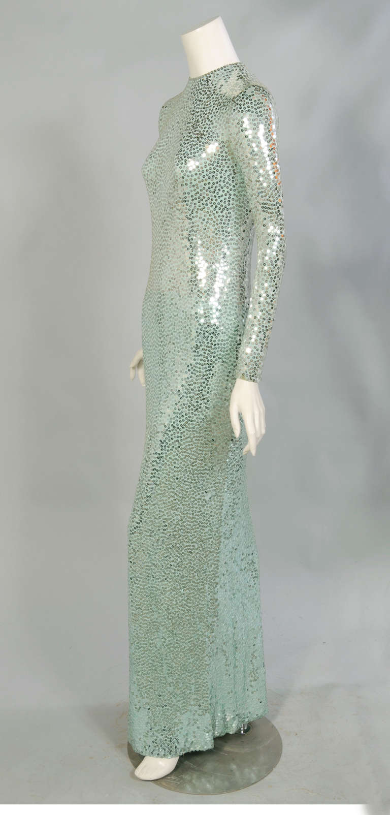 This dress is from the personal collection of Norell model and muse Denise. She has shared so many wonderful stories of her years working and traveling with Norman Norell. I am thrilled to be able to offer this stunning and iconic silver on  green