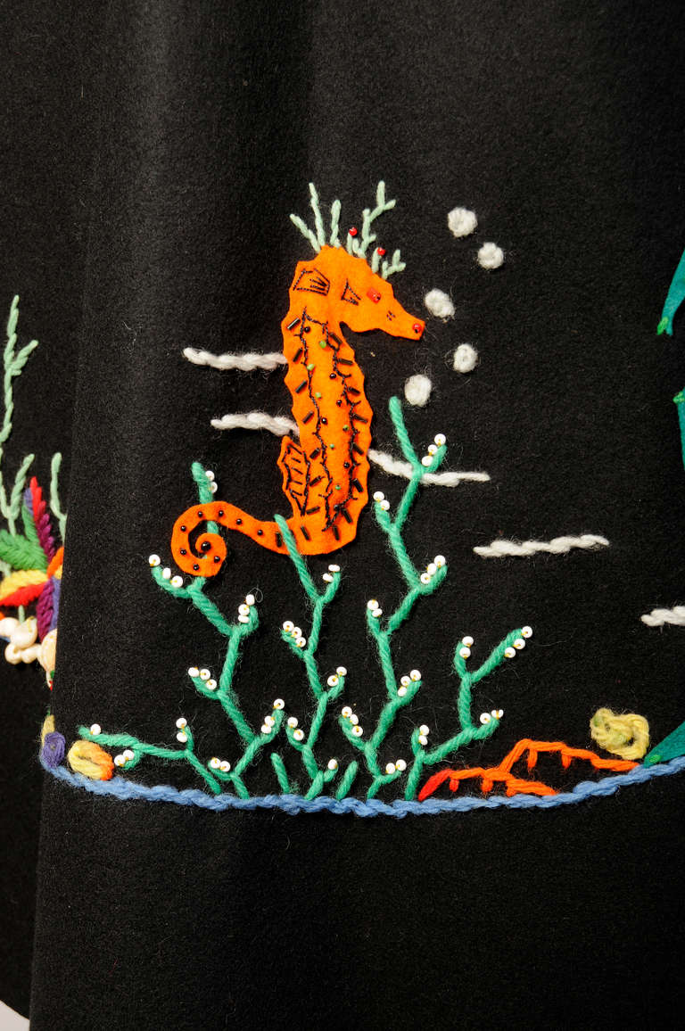 The best ever 1950's felt appliqued circle skirt, this piece incorporates real branch coral and sea shells into the design along with the stuffed felt appliques and embroidery. There is a giant starfish made from sea shells. All of the fish are