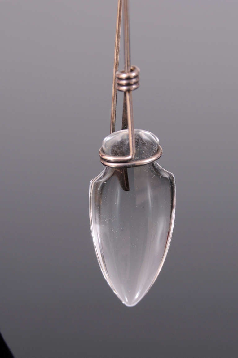 Sterling silver wire pairs beautifully with the rock crystal in these earrings from the legendary model, muse and designer Tina Chow. The rock crystal  is in the shape of an amphora and it is wrapped in the sterling silver wire. The earrings are