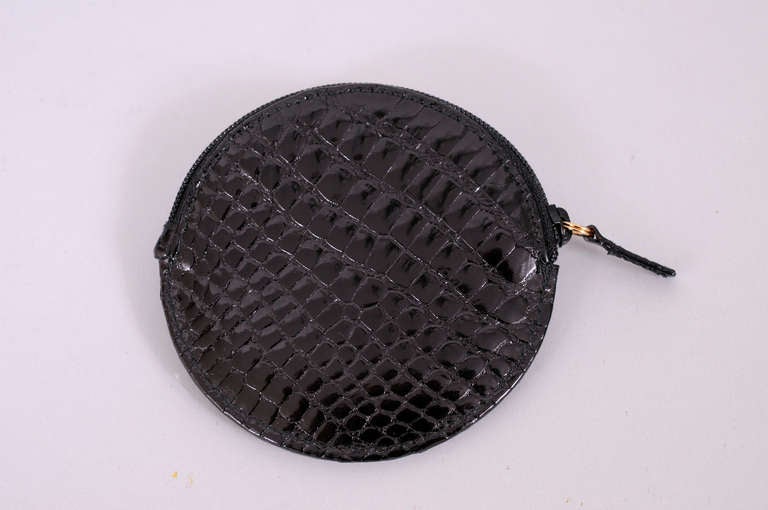 Shiny black alligator on both sides, with a black zipper at the top make a very elegant coin purse from Gucci. Never used, it is in excellent condition.
Measurements;
3.5