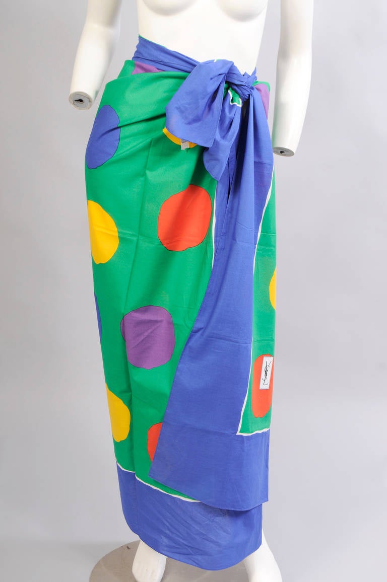 Bright primary colors enliven this large cotton pareo or shawl from Yves Saint Laurent Foulards. The big colorful dots add a sense of whimsy. Never used, it is
in excellent condition.
Measurements;
54