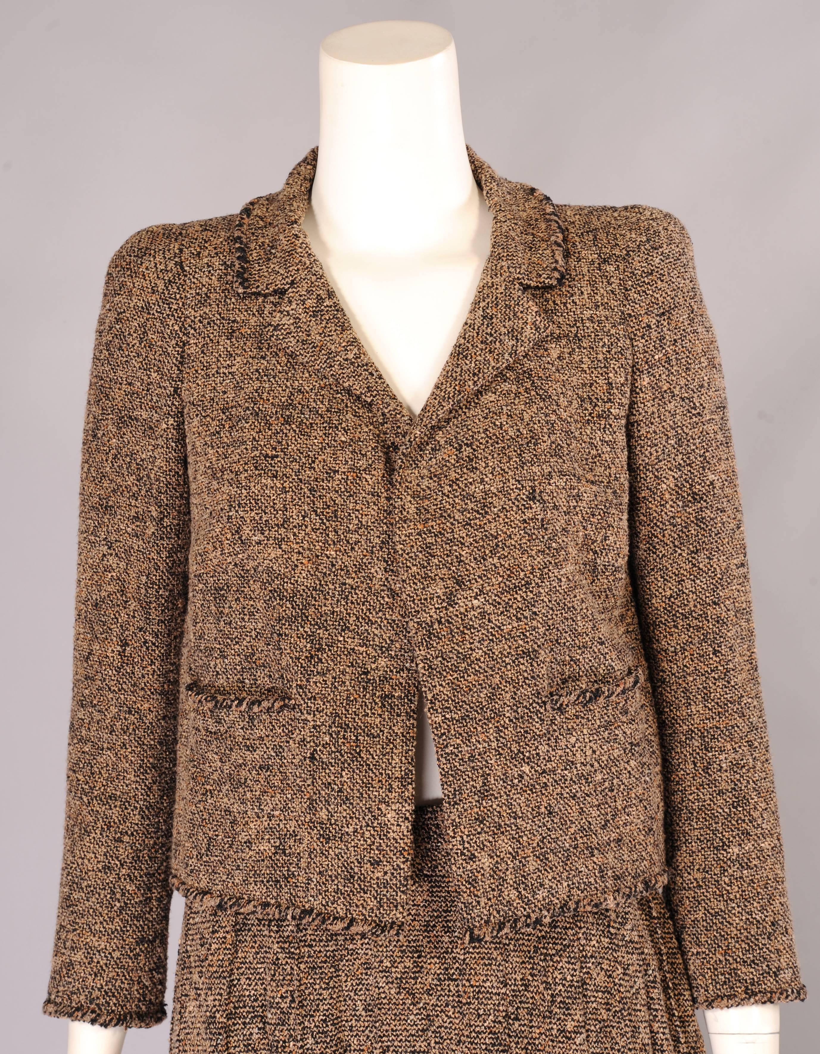 whose creation is the iconic boxy suit in tweed with braid trims