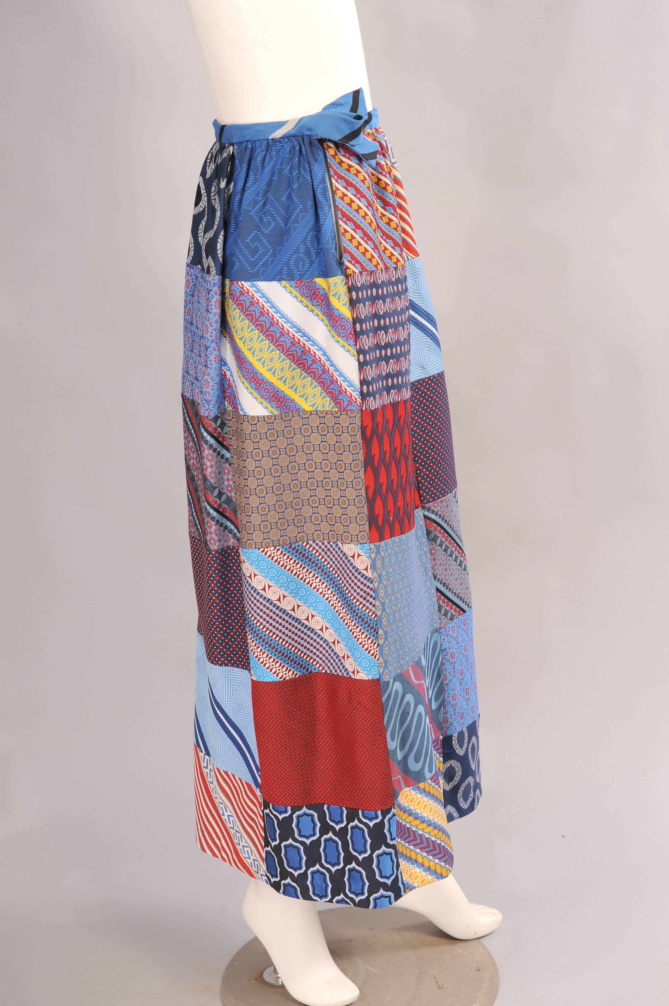This fun patchwork maxi or evening skirt is made from silk necktie fabric. The waistband and decorative bow is made from another silk tie fabric. The skirt is fully lined and it is in excellent condition.
Measurements;
Waist 26"
Hips