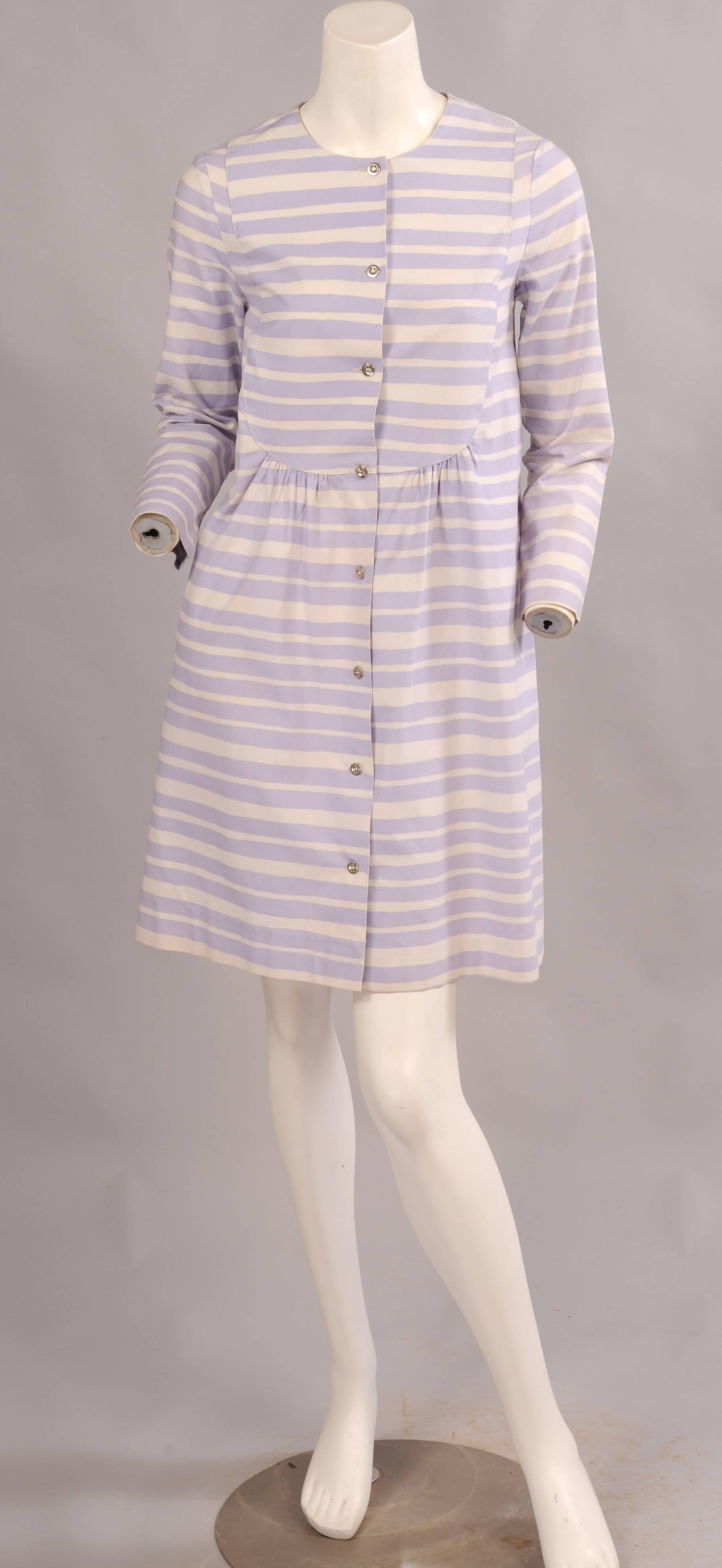 Design Research in Cambridge, Massachusetts introduced Marimekko fabrics and clothing to the United States in the late 1950's. This dress dated 1966 is designed in the Piccolo pattern in lavender and white irregular stripes. It has a bib front and