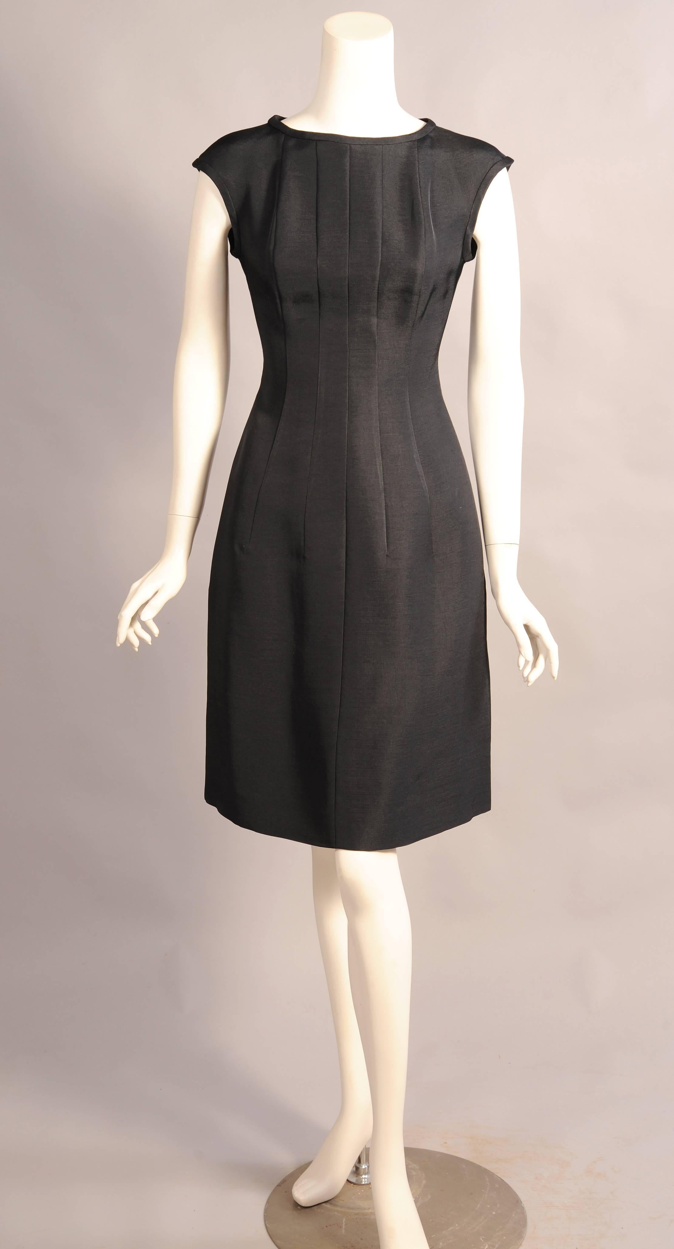 Karl Lagerfeld has designed this dress with five vertical seams on the front to insure a perfect fit. The dress has a bound neckline and armholes and there are pockets concealed in the side seams. The back of the dress has two vertical seams on