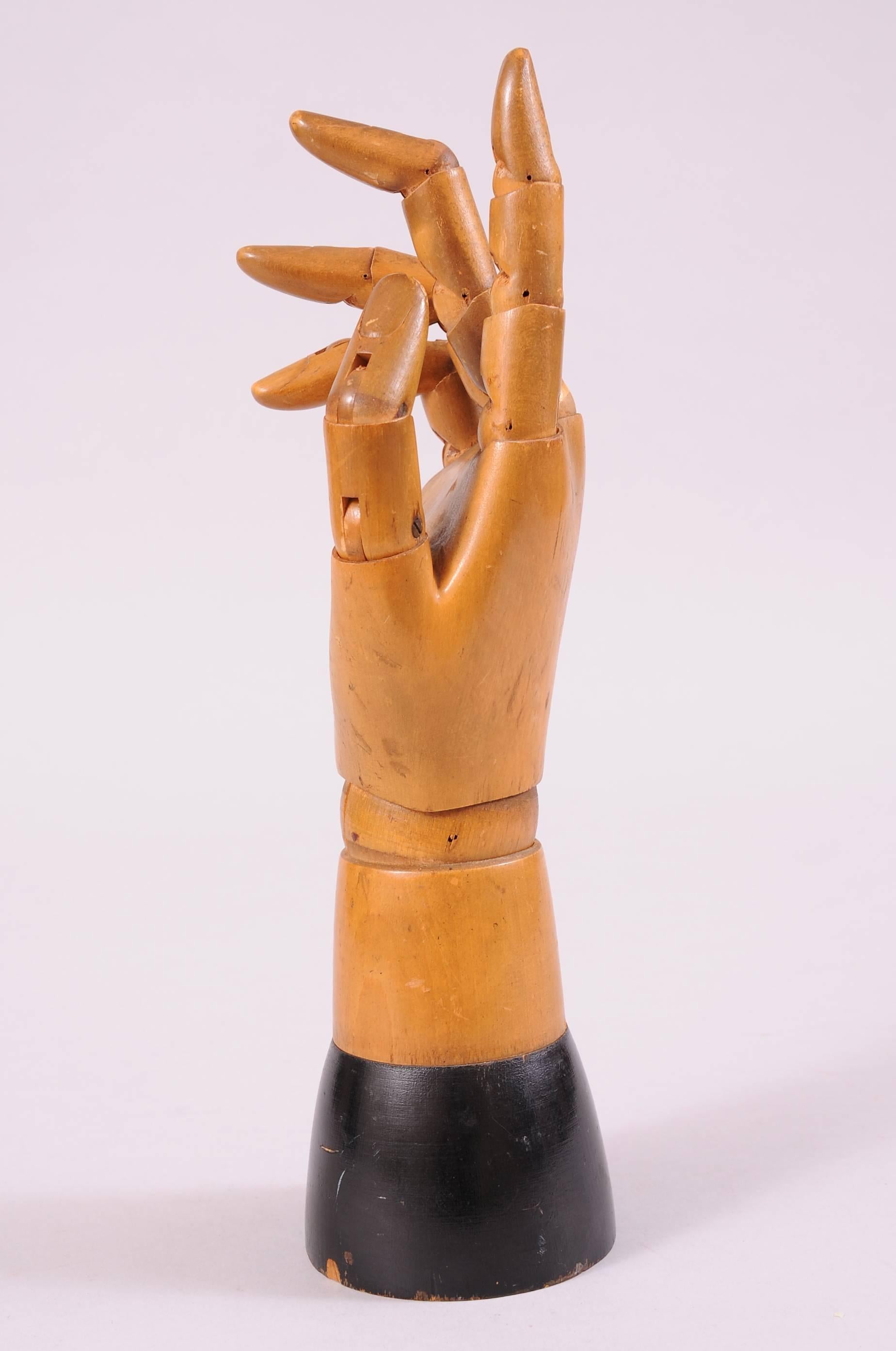 This striking sculptural life size model of a hand was made in Belgium in the early part of the 20th century. The joints are fully articulated at the wrist and all of the finger joints allowing you to change the position of the hand.  it would be a