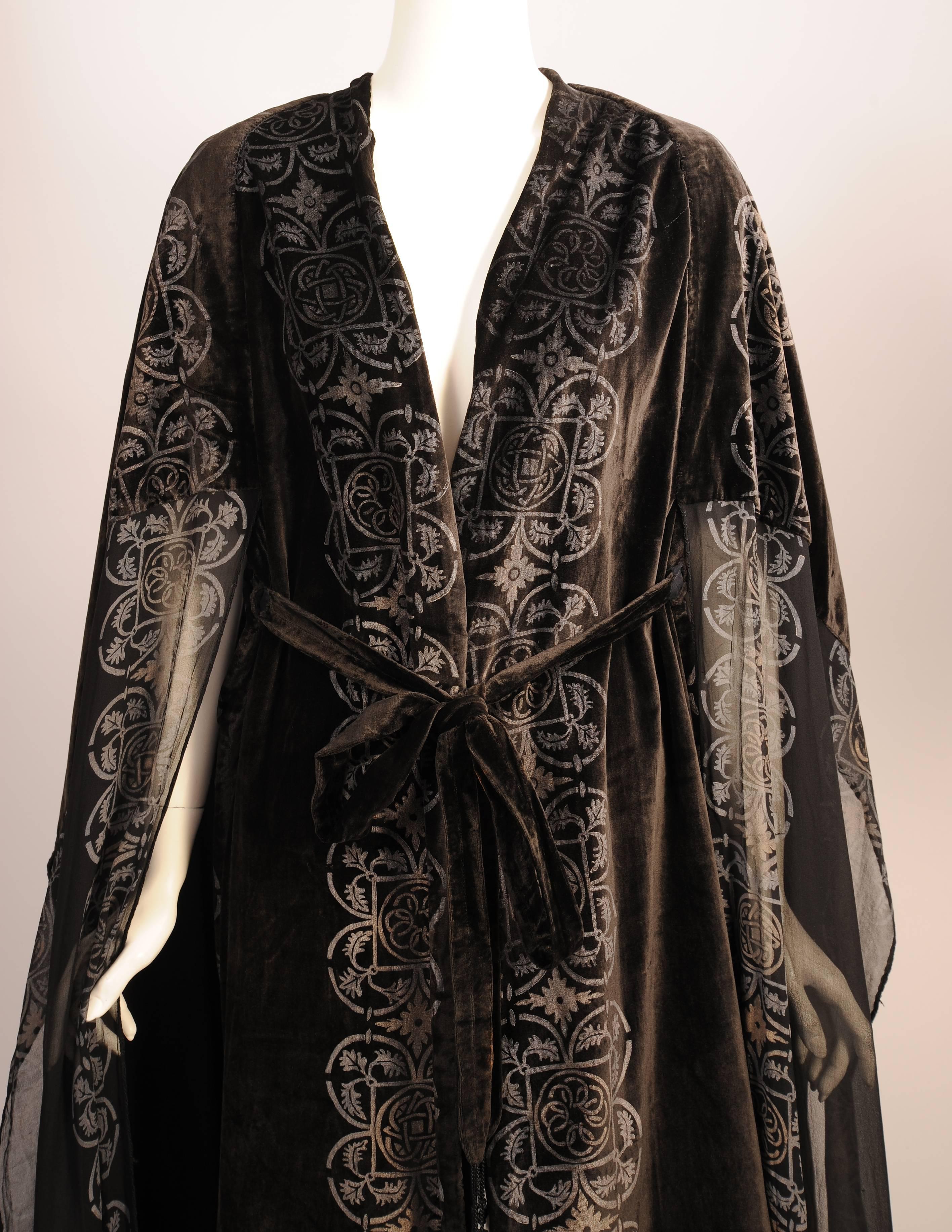 This elegant piece comes from the wardrobe of Margaret Draper, the richest girl in New England, who married an Italian Prince and became the Princess Boncampagni.  Black silk velvet is hand stenciled with silver and gold pigment in a quatrefoil