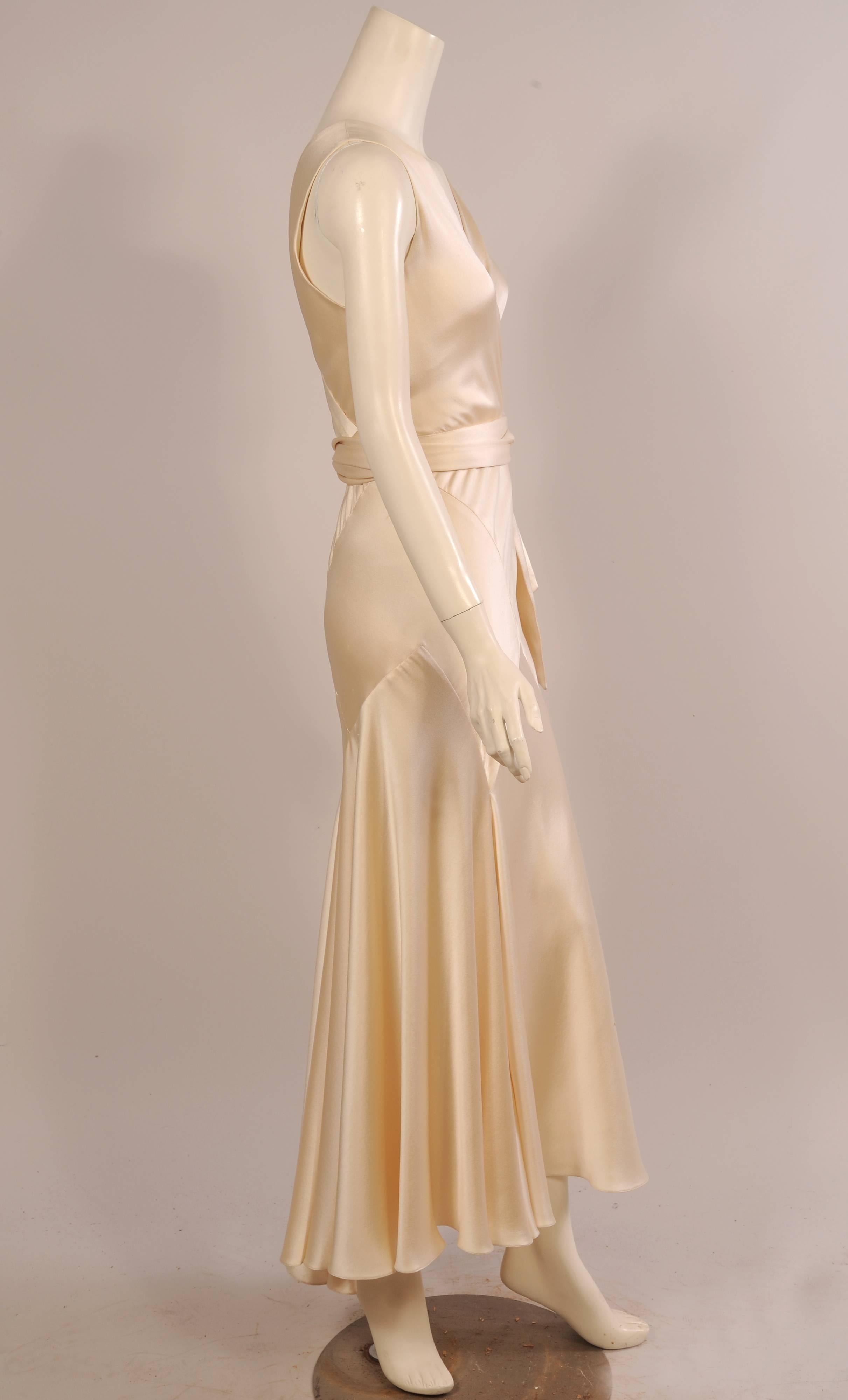 This elegantly sexy bias cut silk charmeuse gown has all of the glamour of a vintage 1930's gown in a 21st century evening dress with gorgeous fabric and flawless construction. The sleeveless bodice with a low neckline front and back is very