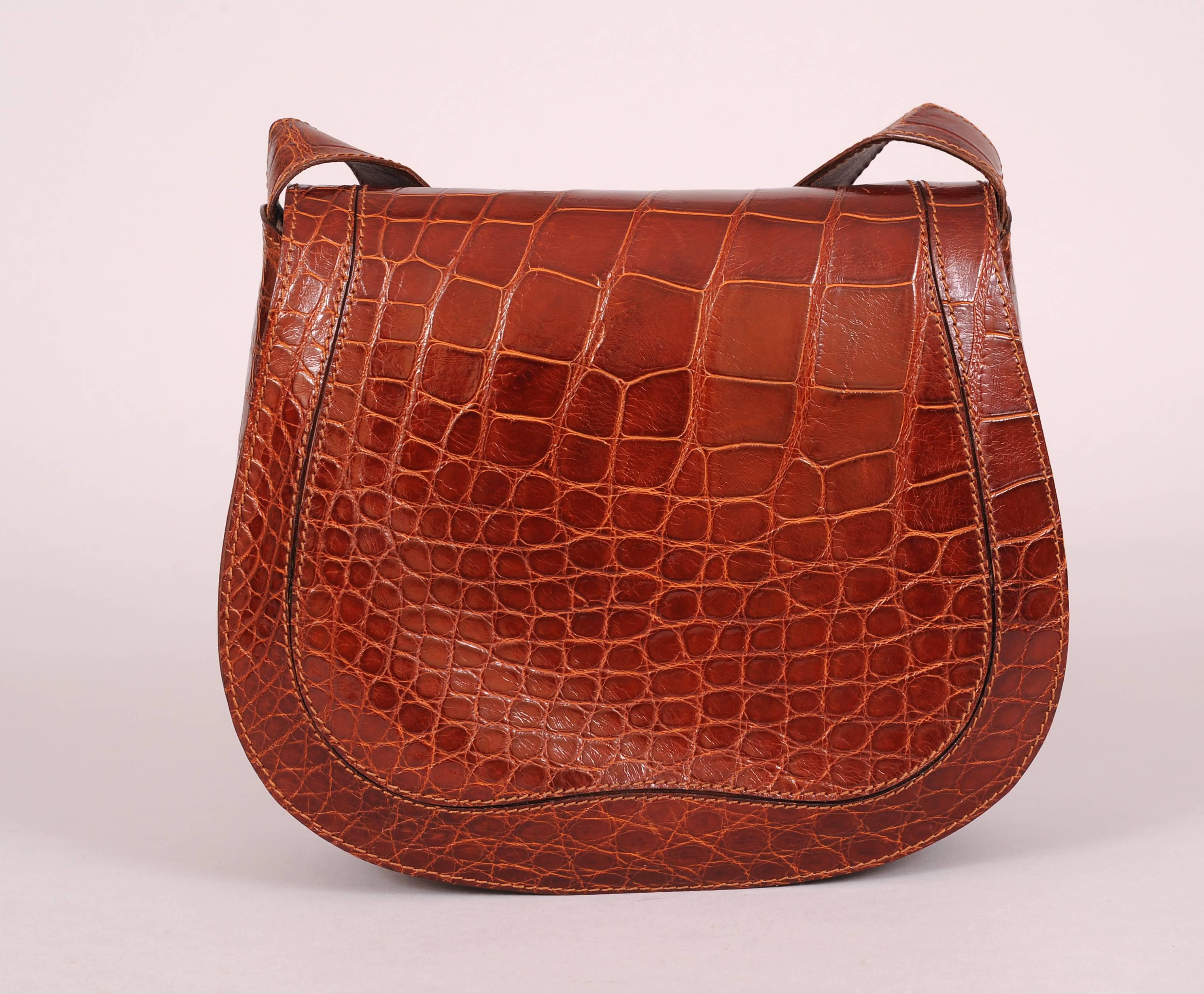 Designed by Hamilton Hodge who has also designed for Bottega Veneta, Ferragamo and  Donna Karan this deVecchi genuine alligator bag is in pristine condition and looks as if it was never used. The front flap is double stitched all around to create a