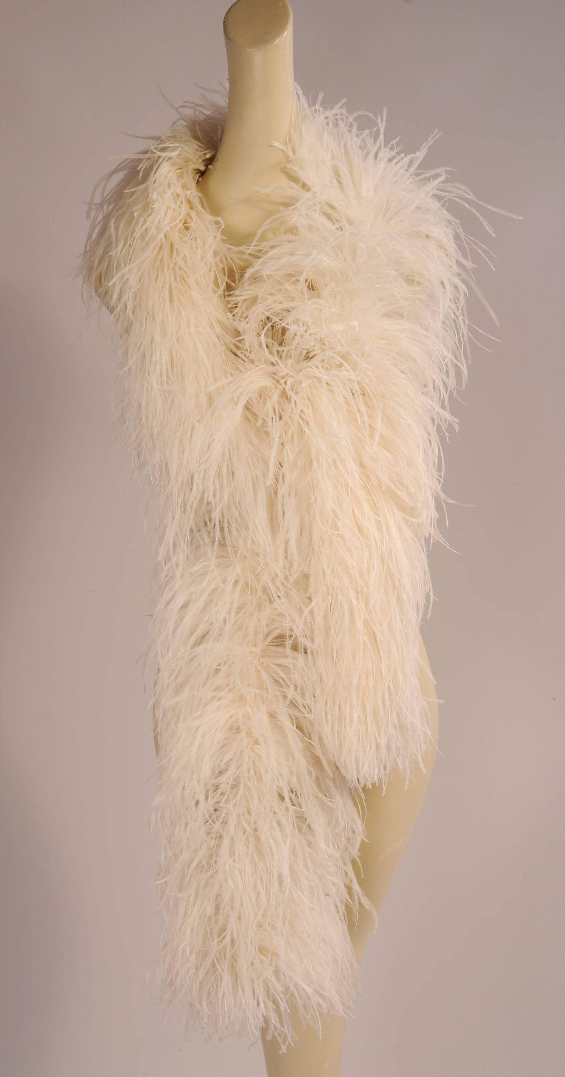 An estate find this long and luxurious bright white ostrich feather boa is in excellent condition.