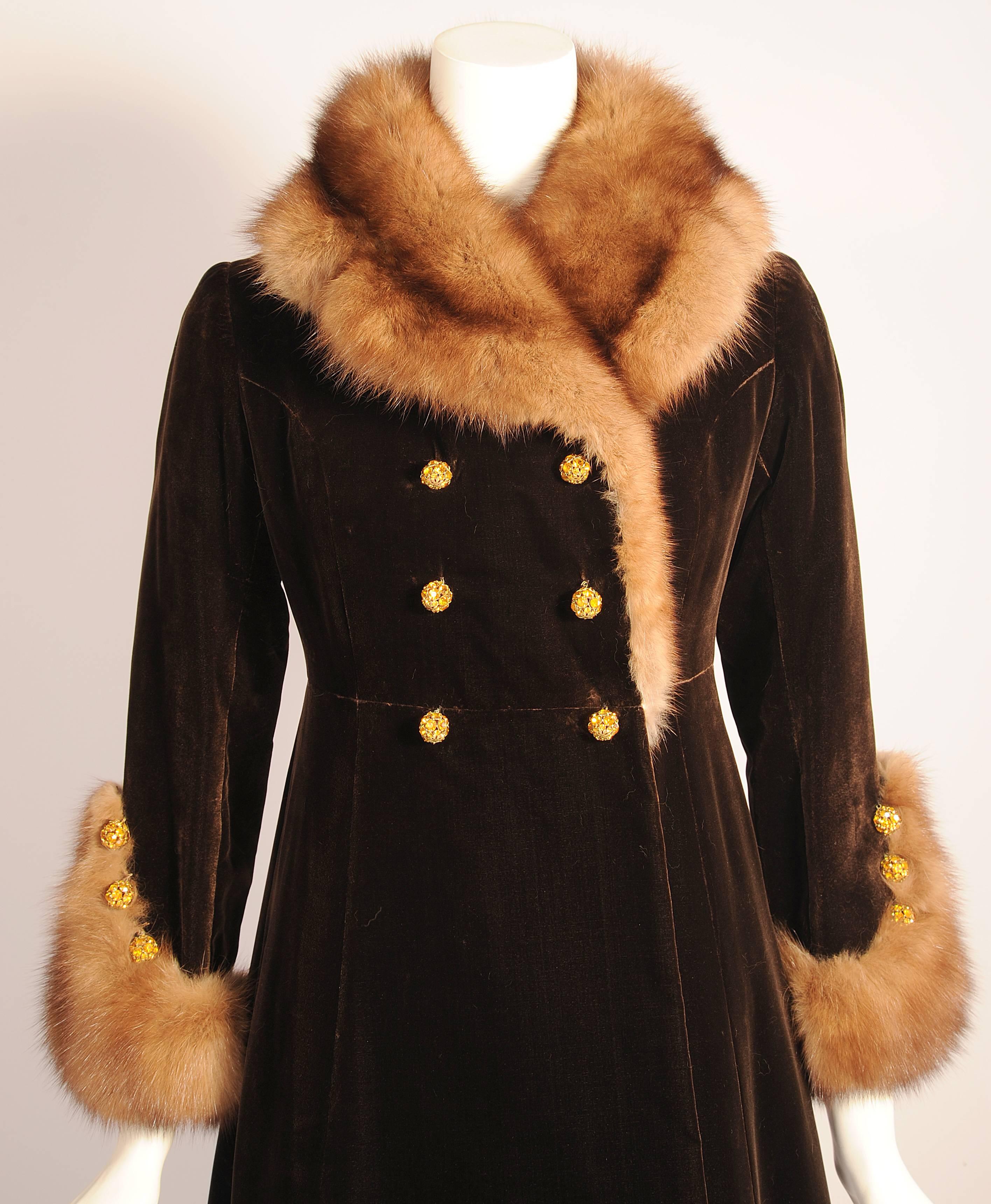 This fabulous piece of YSL haute couture comes from the estate of an American Department Store heiress. Luxurious Russian sable is used for the notched collar and it also curves around the intricately designed cuffs. The double breasted coat closes