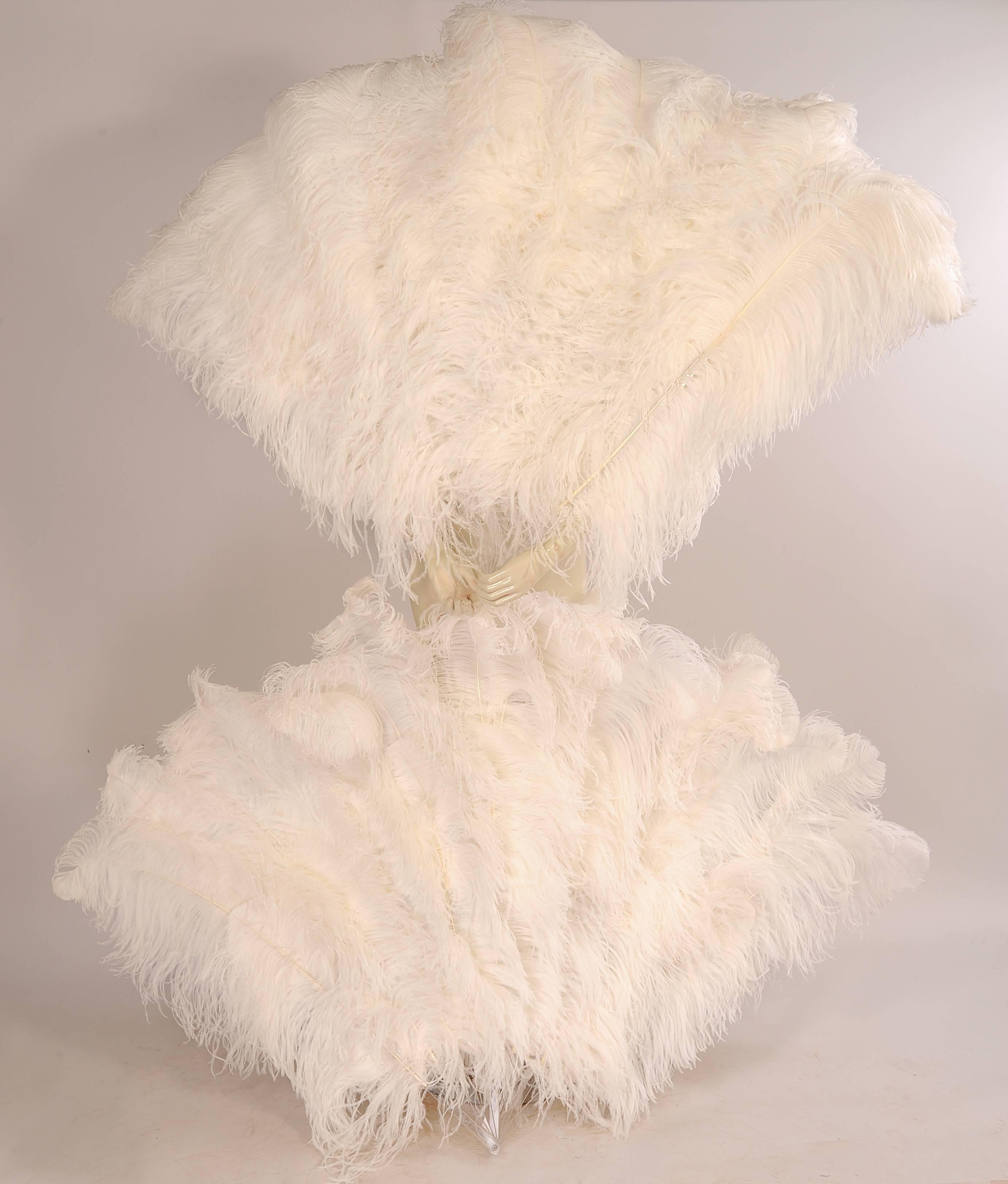 From the Paris atelier of the late Patrick Kelly these oversized Lucite and white ostrich feather fans are just so glamorous.  They were used on the runway during the Autumn Winter 1989 collection. The Lucite sticks almost disappear into the