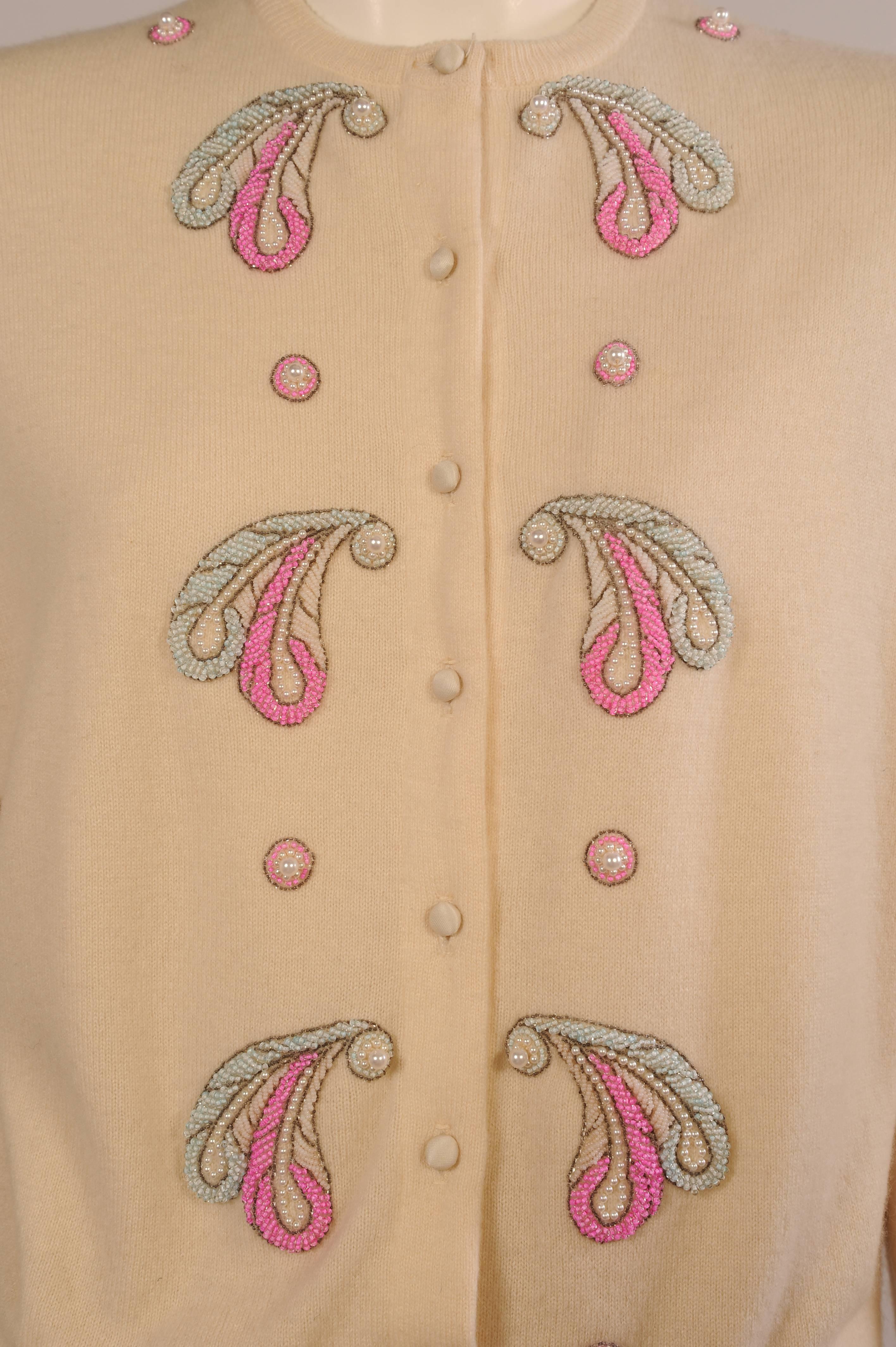 Inspired by Helen Bond Carruthers Malouf Designs, makers of fine lingerie also created beautiful embellished cashmere sweaters. This cream cashmere sweater has been altered for a more stylish fit. Satin buttons have been added as well as lush silk