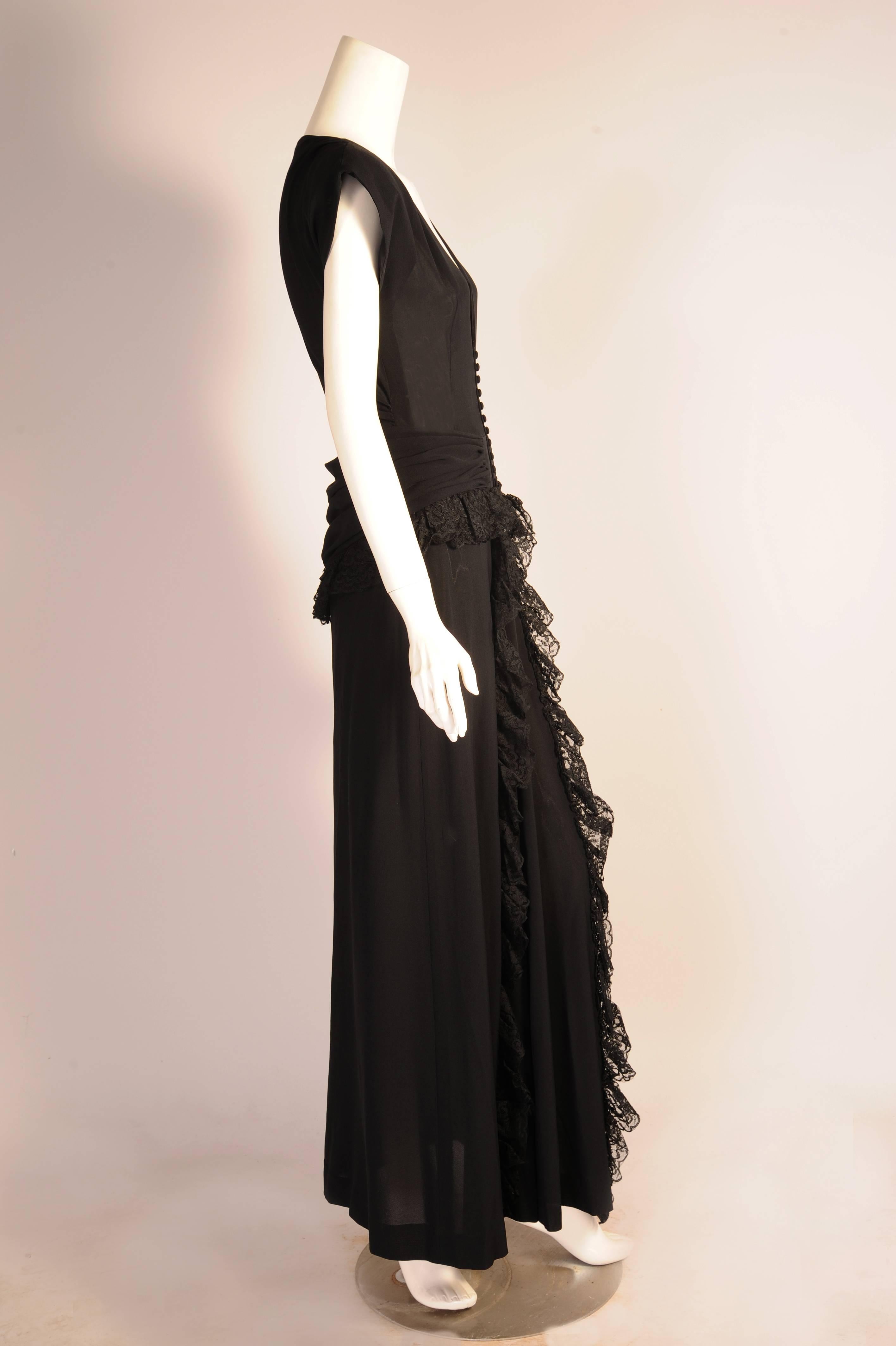Eisenberg Originals Lace trimmed Black Crepe Evening Gown with Peplum, 1940s  In Excellent Condition In New Hope, PA
