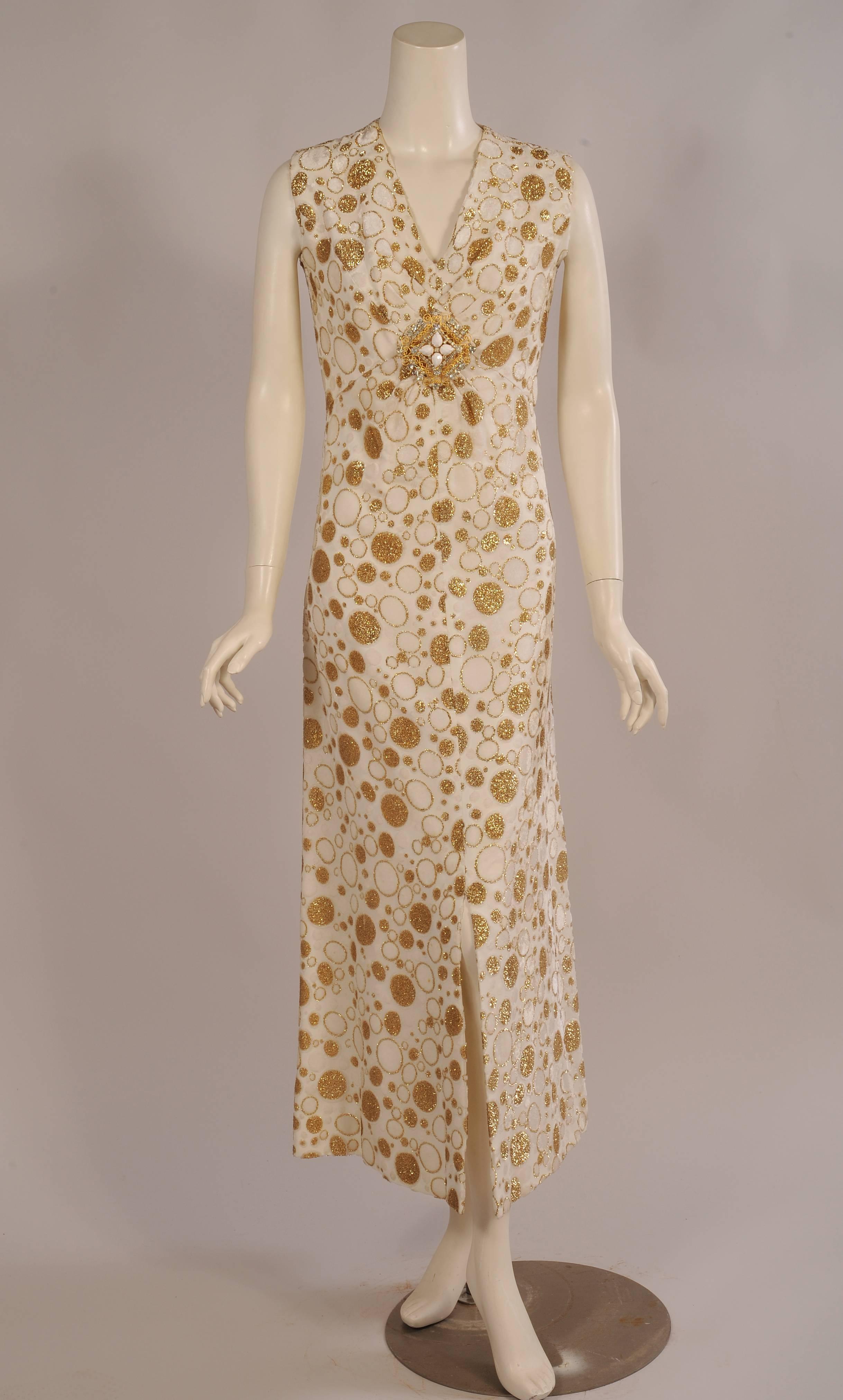What a glamorous cut velvet and lurex on chiffon dress with polka dots in many sizes. The white ones are cut velvet, some edged with gold lurex thread that is used for the velvet edged gold dots. The sleeveless dress has a V shaped neckline with a