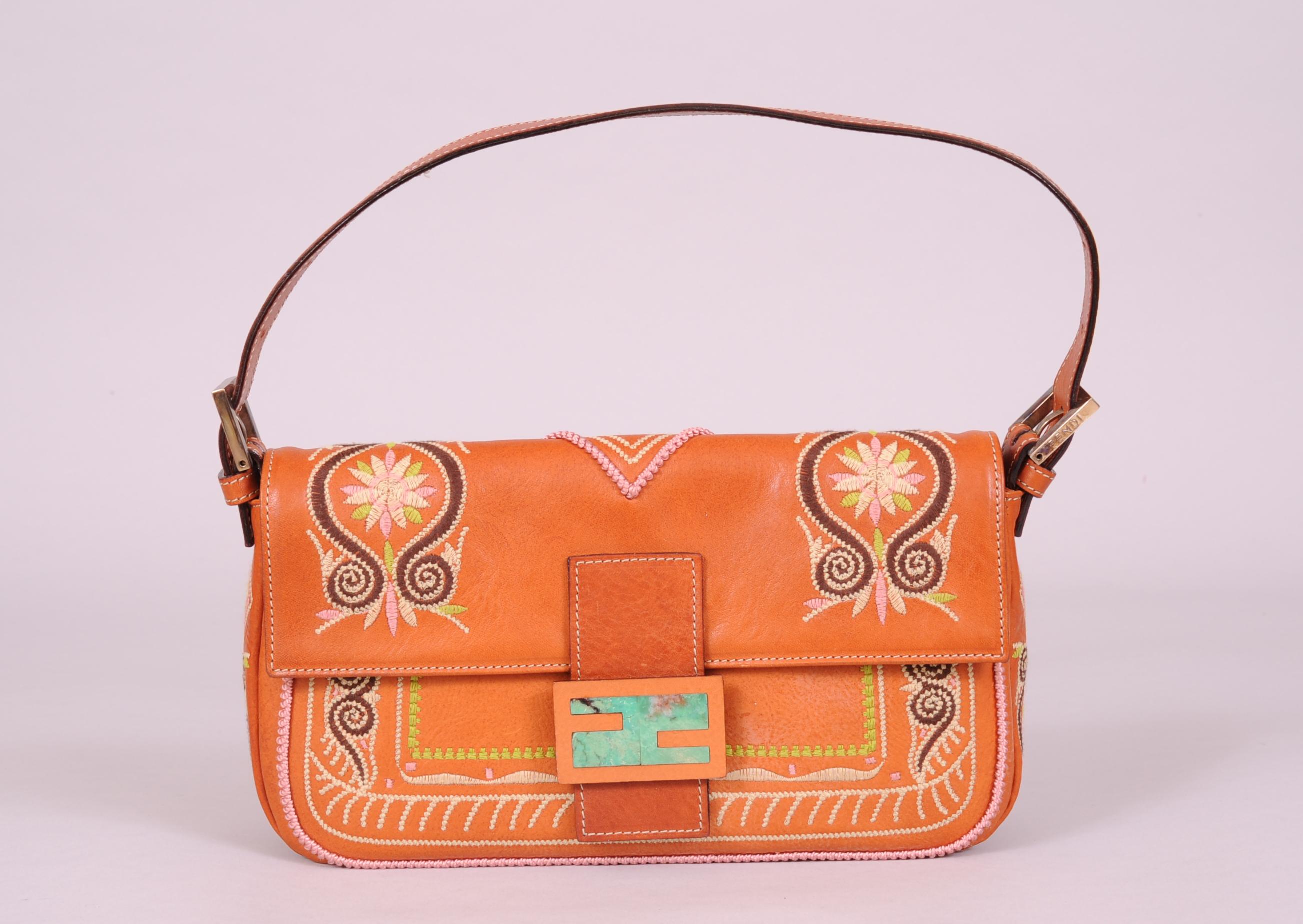 Fendi baguettes come in so many variations but this embroidered leather bag caught my eye. Bringing a touch of Hippie Chic  to this bag, the embroidery is both floral and geometric in pale pink, green and cream as well as chocolate brown. The clasp