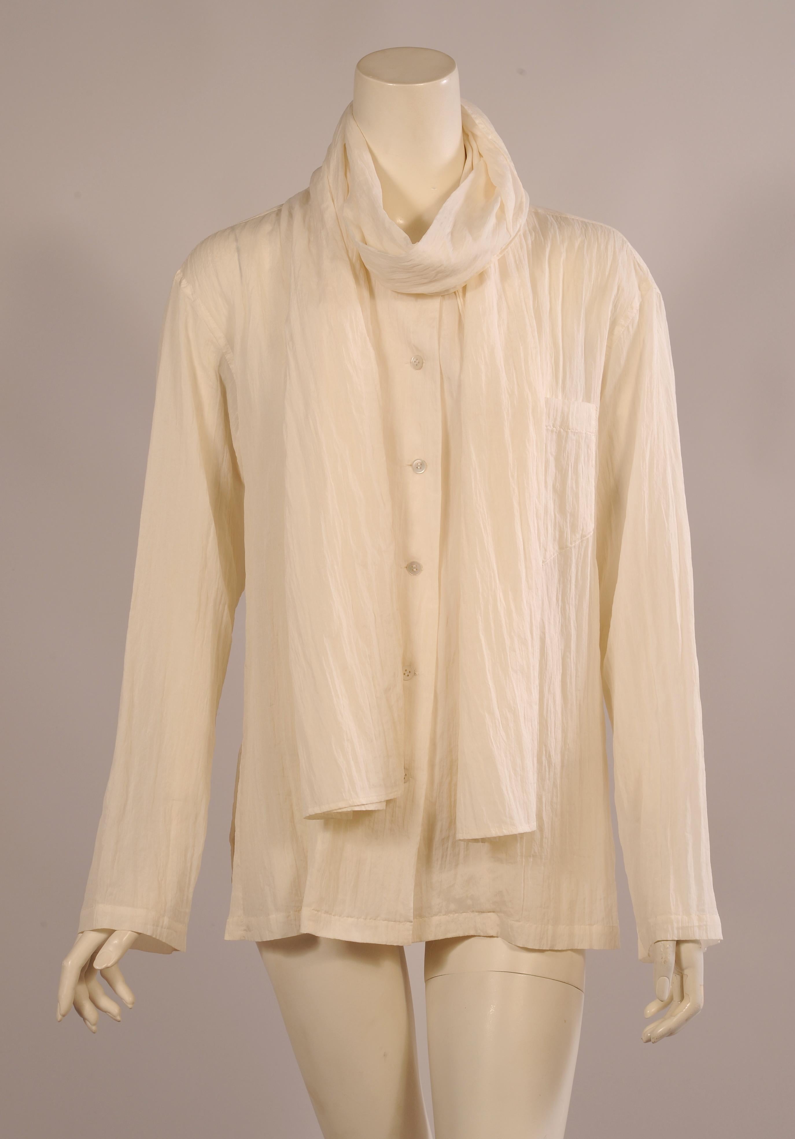 This is a great crinkled cream silk blend blouse from Issey Miyake. It has an attached scarf which can be worn in a variety of ways creating different looks. It is marked size Large and it is in excellent condition.
Measurements;
Shoulders 20