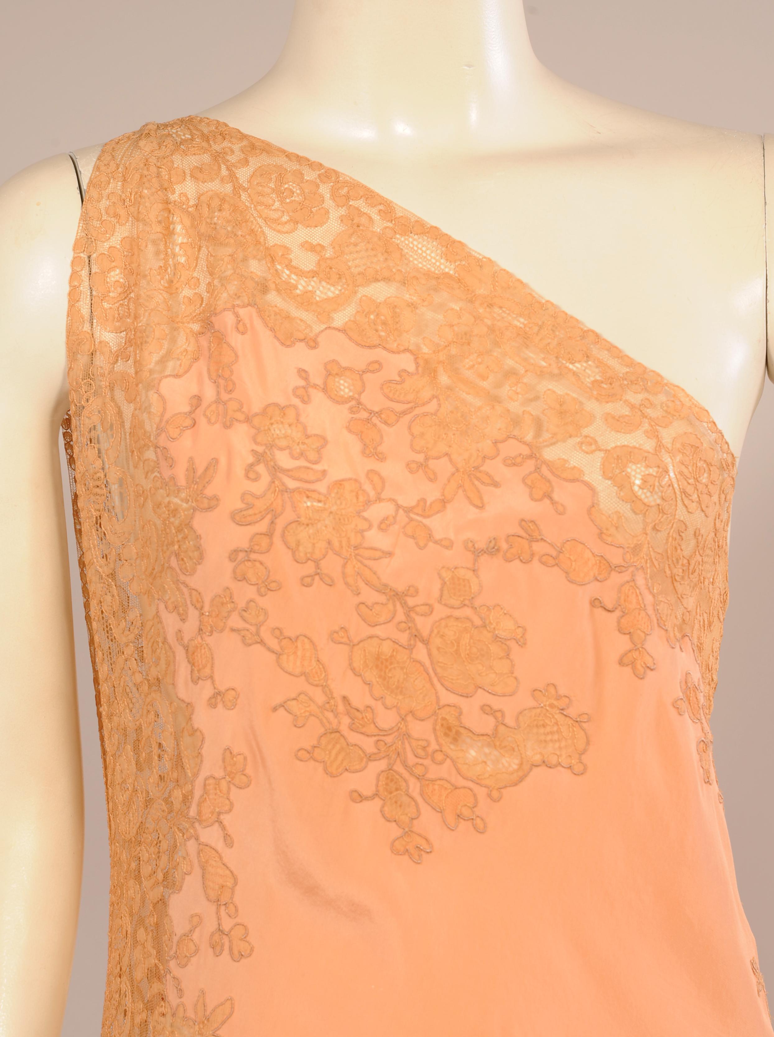 Pretty enough for an evening on the town this one shoulder negligee is a rare piece. I have never seen one like it from this period. A diagonal band of lace angles down from the right shoulder to the left side and all the way around the back. There
