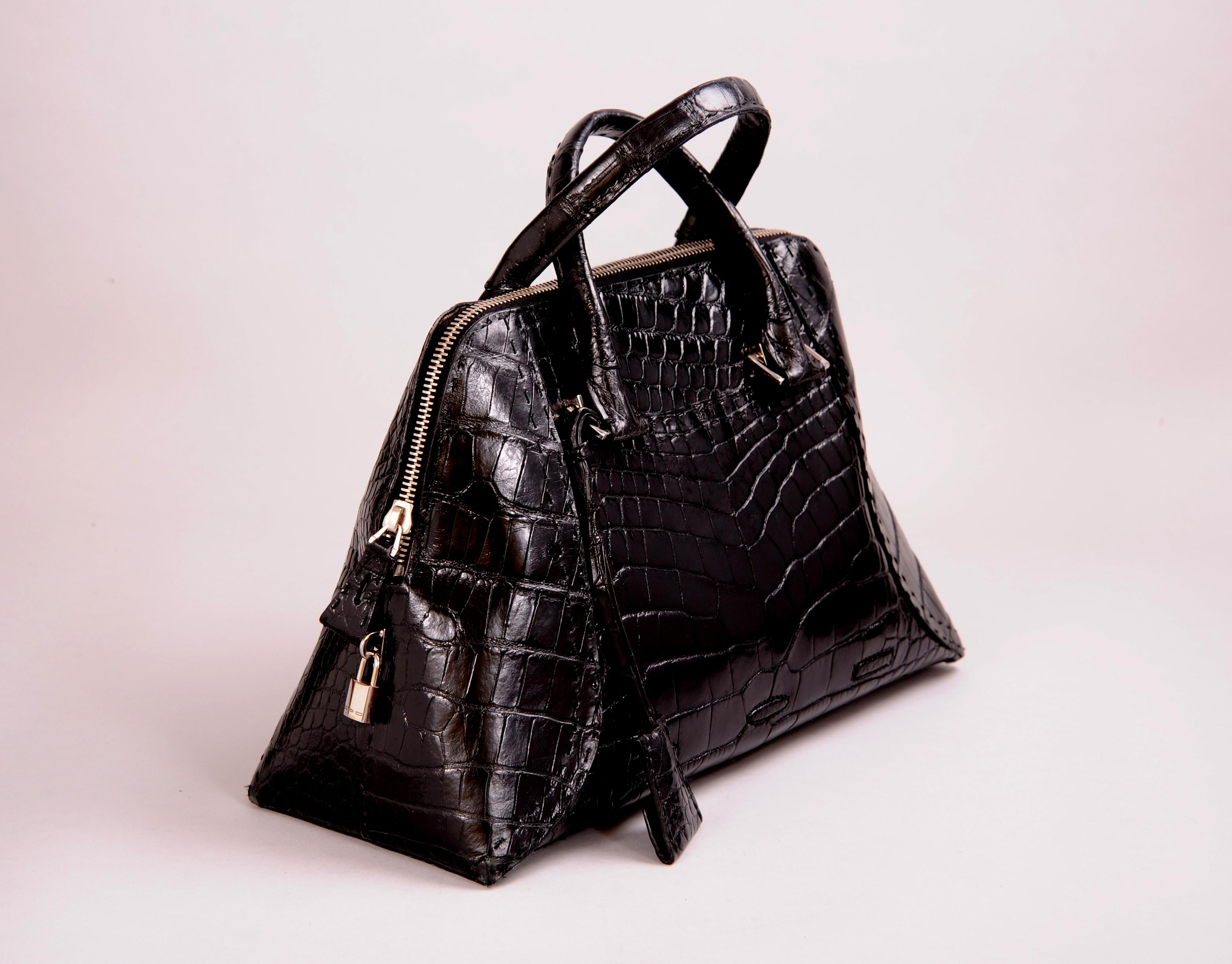 A stunning black alligator bag from American designer V. Bruce Hoeksema founder of VBH.  Handcrafted in Italy from the finest skins this bag is perfect for everyday with lots of room for all of your necessities. It comes with a key clochette and
