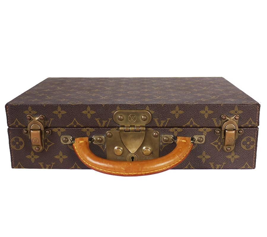 This is a beautiful used Louis Vuitton Jewelry case. This jewellery case in Monogram canvas is the ideal refined travel accessory. It features 13 different-sized compartments and closes securely with an S-lock and two trunk latches. Original Retail