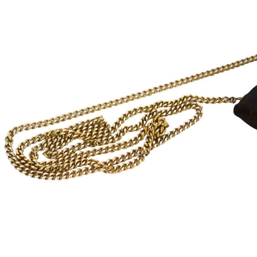 Chanel vintage necklace. Mini classic is made from silk stain. Interesting vintage Chanel from 1980's.

    Main color : Black
    Material : Gold tone metal and silk satin
    Lining : Polyurethane
    Includes : Chanel box
    Authenticity :