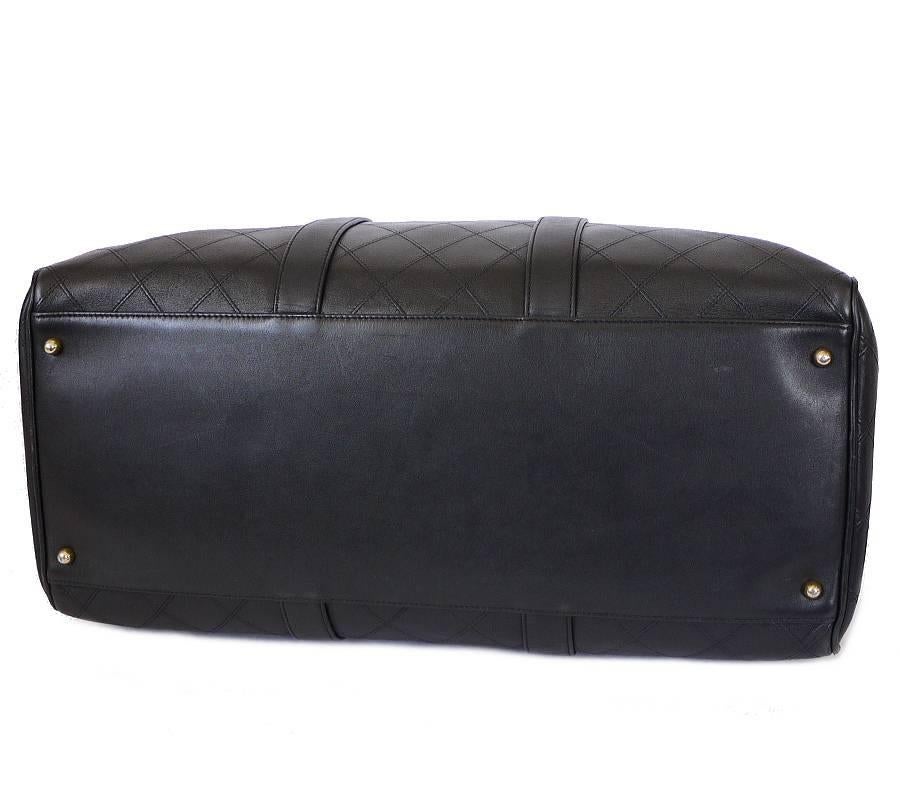 Chanel black lambskin flat quilt duffle carry-on bag. Comes with the detachable shoulder strap. Light weight, easy to carry luxury CHANEL travel  bag. A perfect bag for daily or overnight traveling.

    Main color : Black
    Material :
