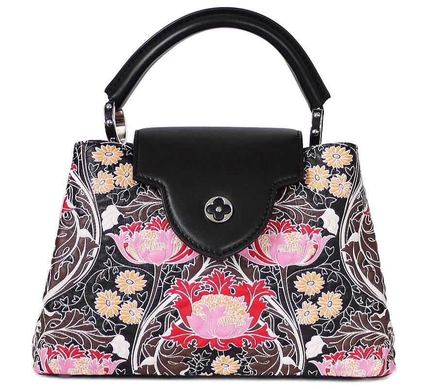 Louis Vuitton Capucines BB Flowers M94717 in great condition. A wildflower print borrowed from the Summer 2015 runway dresses up the covetable Capucines BB. Part of the pleasure of owning this bag is choosing how to wear it: with the flap in to show