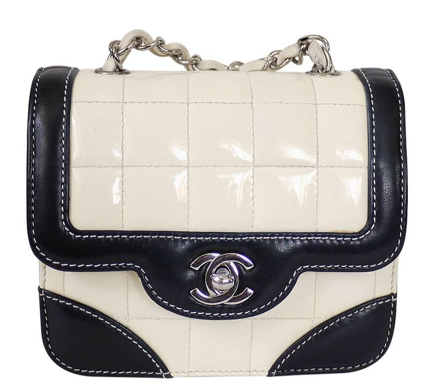 Vintage Chanel bicolor mini classic shoulder bag. In chic Chocolate-bar quilted ivory white patent leather, and with a gorgeous cross-body chain strap, this bi-color mini blends timeless Chanel elegance with everyday city style. Black lambskin