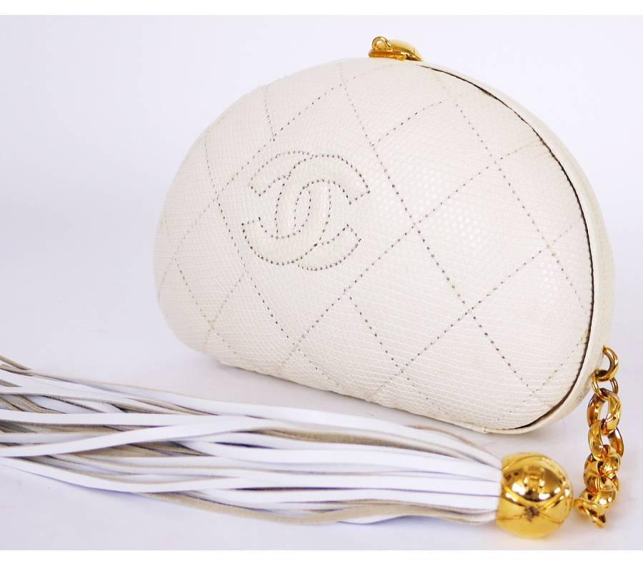  CHANEL white lizard skin frog month clutch bag. This is super rare vintage CHANEL bag. Half moon shaped clutch bag with extra long tassel. This is one of a kind, collectible vintage CHANEL. Never out of style, you can adore this clutch bag for many