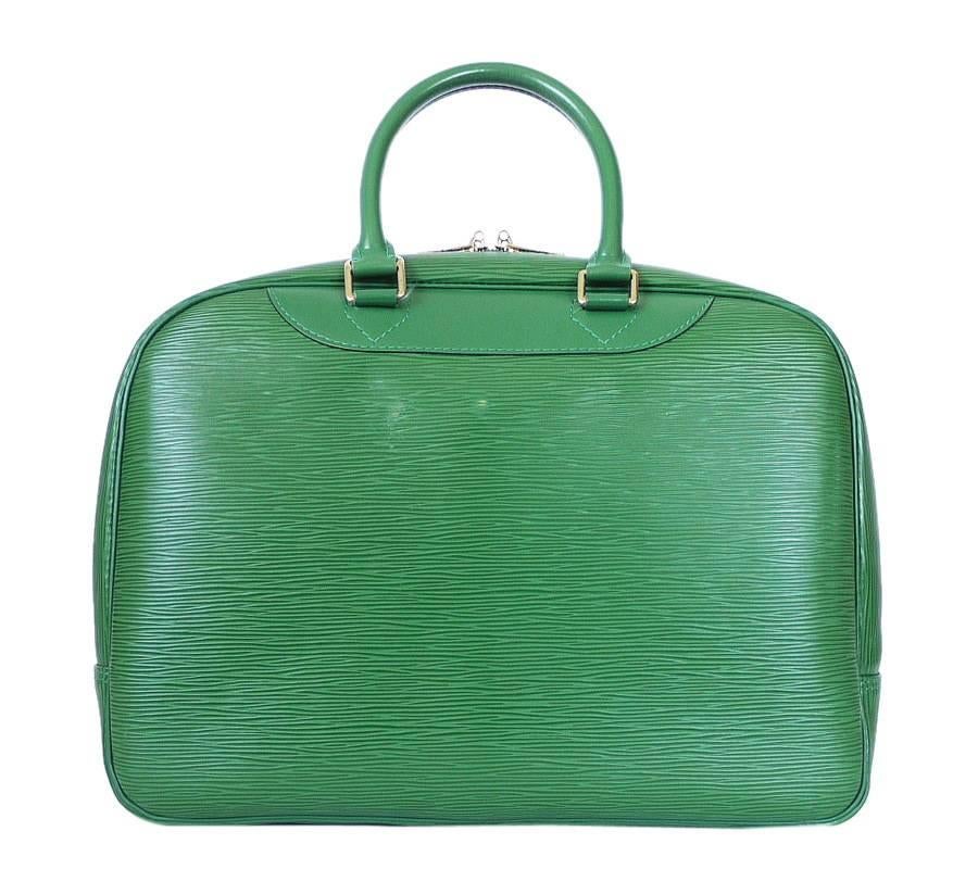 Louis Vuitton Green Epi Deauville Handbag , Special Order item. Deauville is specially designed to keep beauty products perfectly organized. With pockets and holders for bottles and cosmetics, it is protected with a double-zip closure and