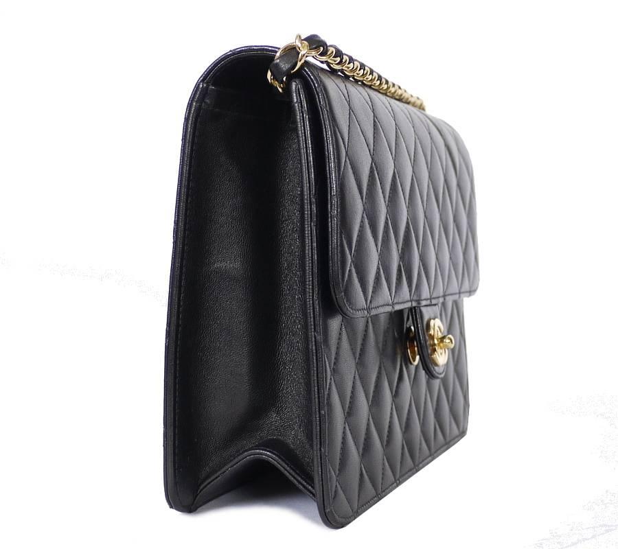 Chanel black lamb skin 3way classic flap bag.Flap closes securely with golden turn lock closure. You can store the strap inside the bag when you wear as clutch bag. By holding the chain inside the bag, you can wear the bag as handbag in short