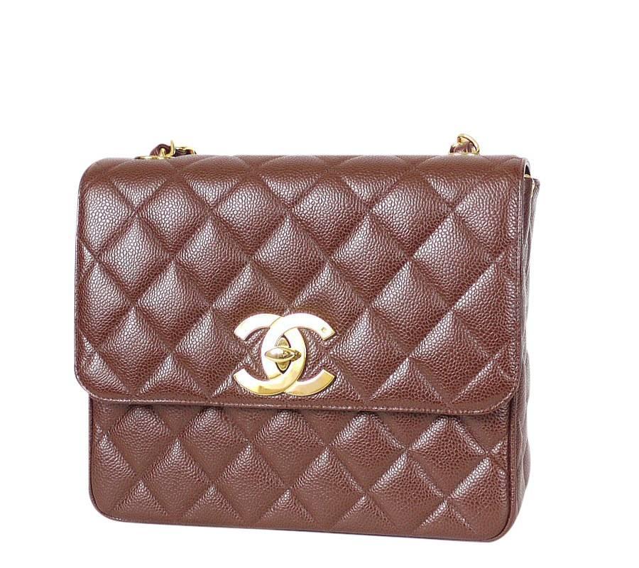 Chanel brown caviar leather classic flap bag. Wearable across the body. This gorgeous vintage Chanel classic was made in 1990's. Well cared, very beautiful. By holding the chain inside the bag, you can wear the bag as handbag or shoulder bag. Hard