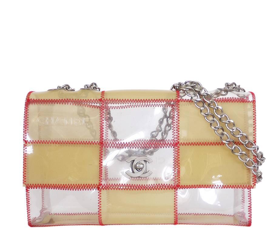 Chanel patchwork quilt plastic chain flap bag in excellent condition. Naked plastic (vinyl) pieces with Chanel embossed logo are sewn. The sliding chain makes it a pleasure to carry over the shoulder or across the body for hands free ease. Extremely