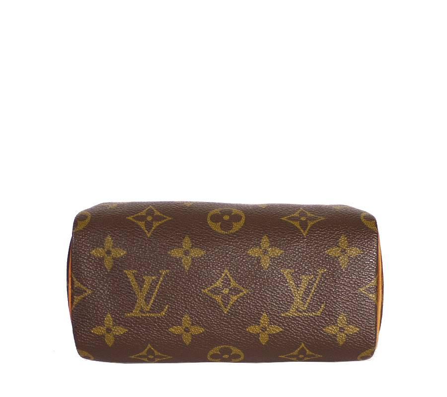 Louis Vuitton Mini speedy handbag with detachable shoulder strap. Old version of current Nano speedy. This ultra-feminine Mini Speedy in iconic Monogram canvas is the ideal way to carry your daily essentials. This perfect miniature version of the