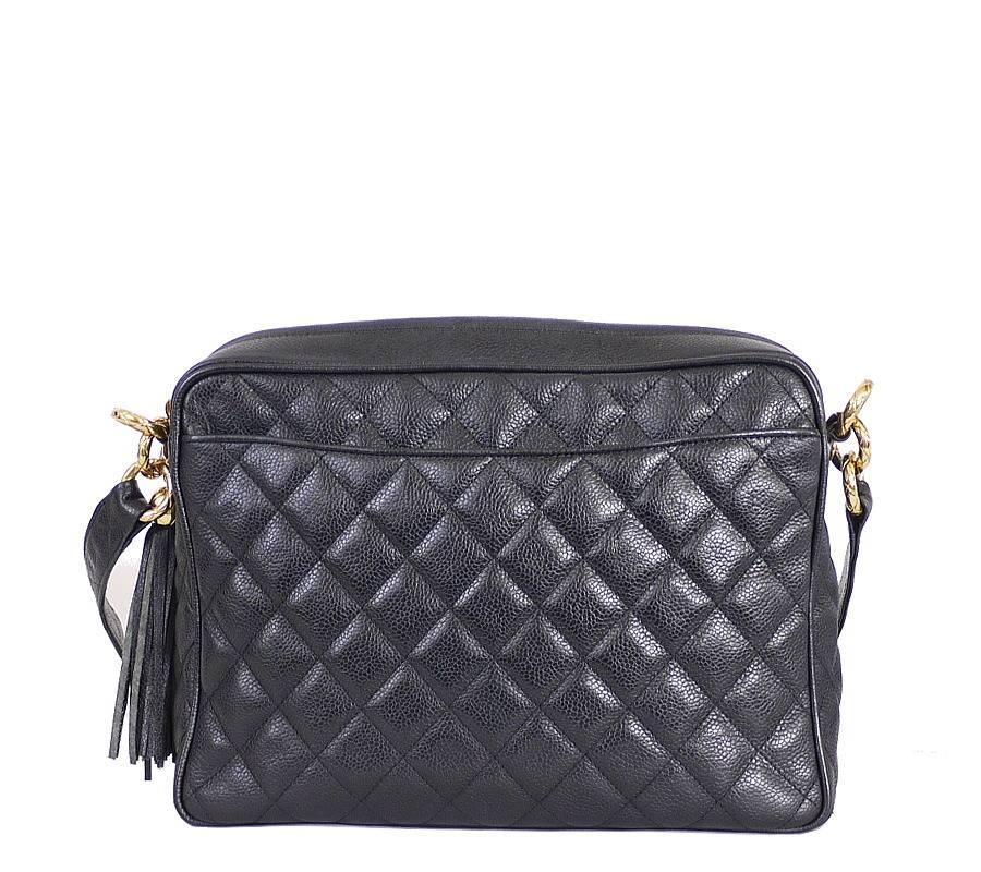 Vintage Chanel Black Caviar tassel shoulder bag.  A comfortable fit around the shoulder or across the body, it is just the right size for toting around essentials.

Feature :Zipper closure, 2 inside zipped pocket and one slit pocket , 2 outside