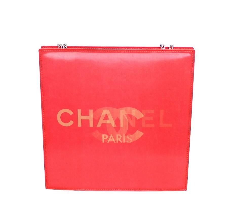 Vintage Chanel evening bag. 3D Chanel Logo in hologram. Very eye catching. This bag can hold your i-phone, small wallet and lipsticks. Simple silver chain can be carried over your shoulder, on your elbow or handheld.  Fabulous bag from year 2000