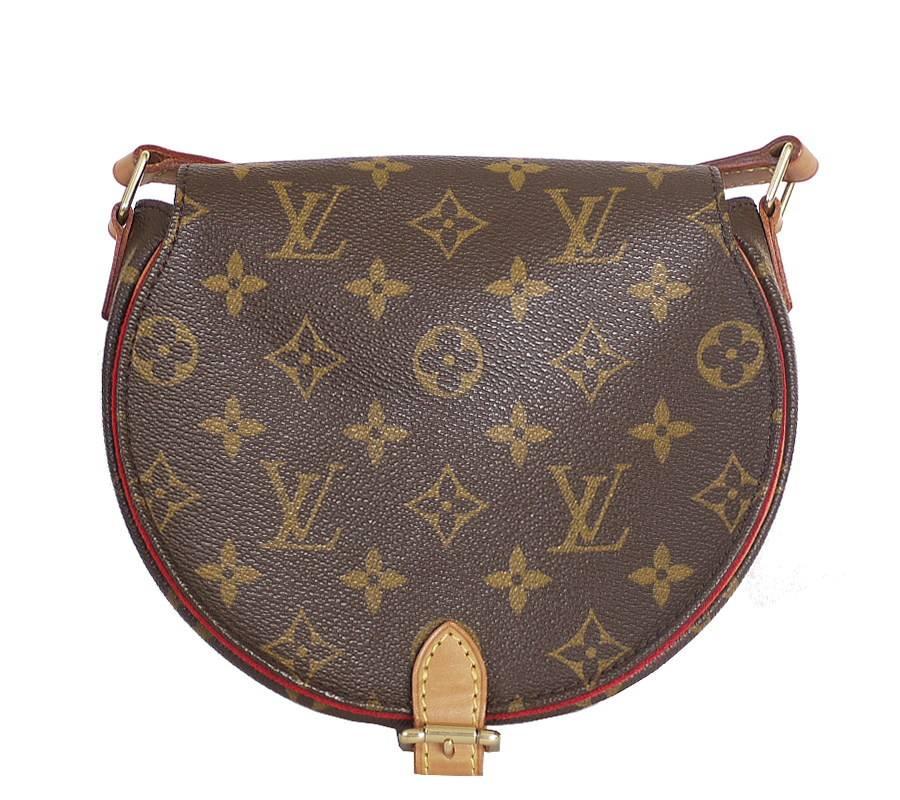 Louis Vuitton Monogram Tambourine Cross body Shoulder Bag. This timeless Tambourine in Monogram canvas easily holds keys, small wallet, smartphone and lipstick. With a strap that adjusts the bag to waist or hip height, the Tambourine bag can be worn