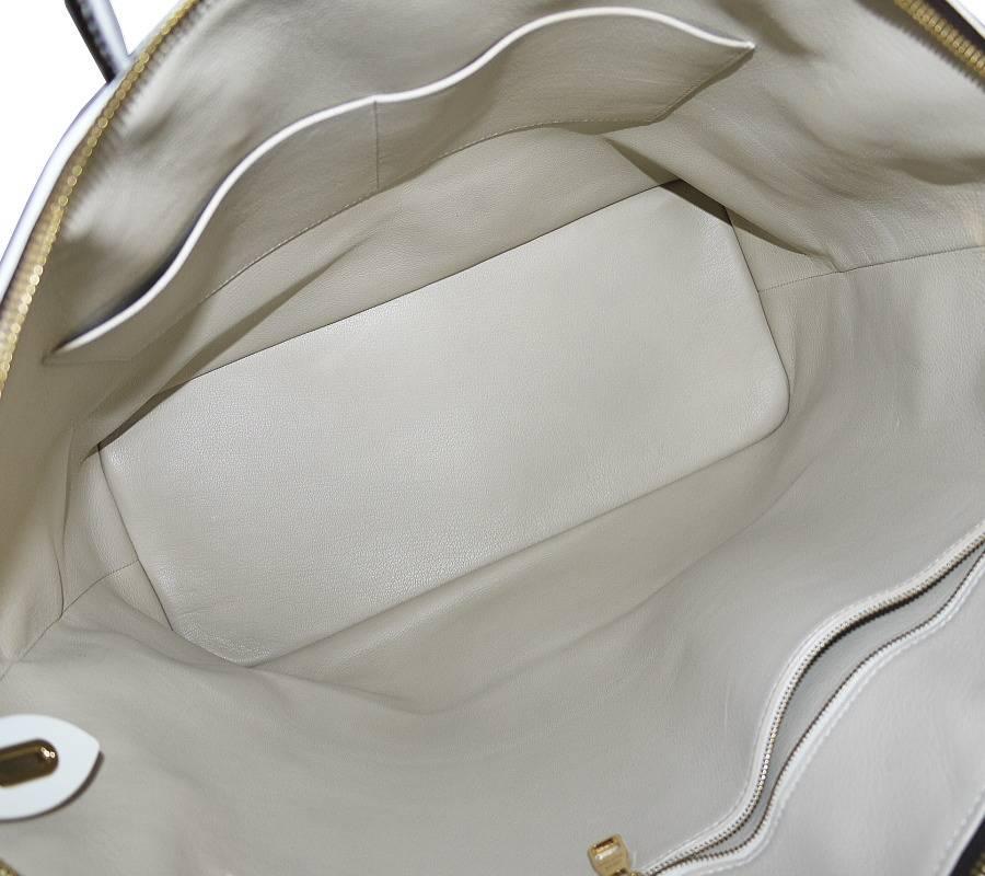 Women's or Men's Louis Vuitton Shiny Monogram Fetish Lockit Voyage Travel Bag For Sale