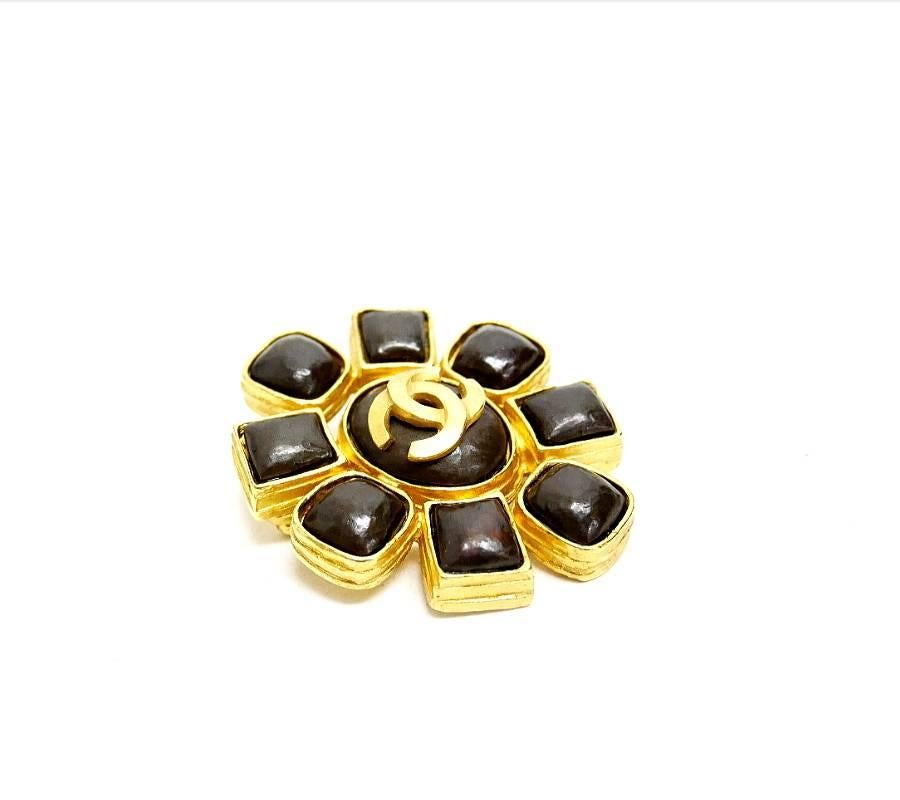 Vintage Chanel Stone earrings and Brooch set. Black(Deep brown) stones are placed on each earrings and brooch. Brooch is large size and quite gorgeous. Both are well cared, very beautiful condition. Collectible vintage Chanel Jewelry. A perfect